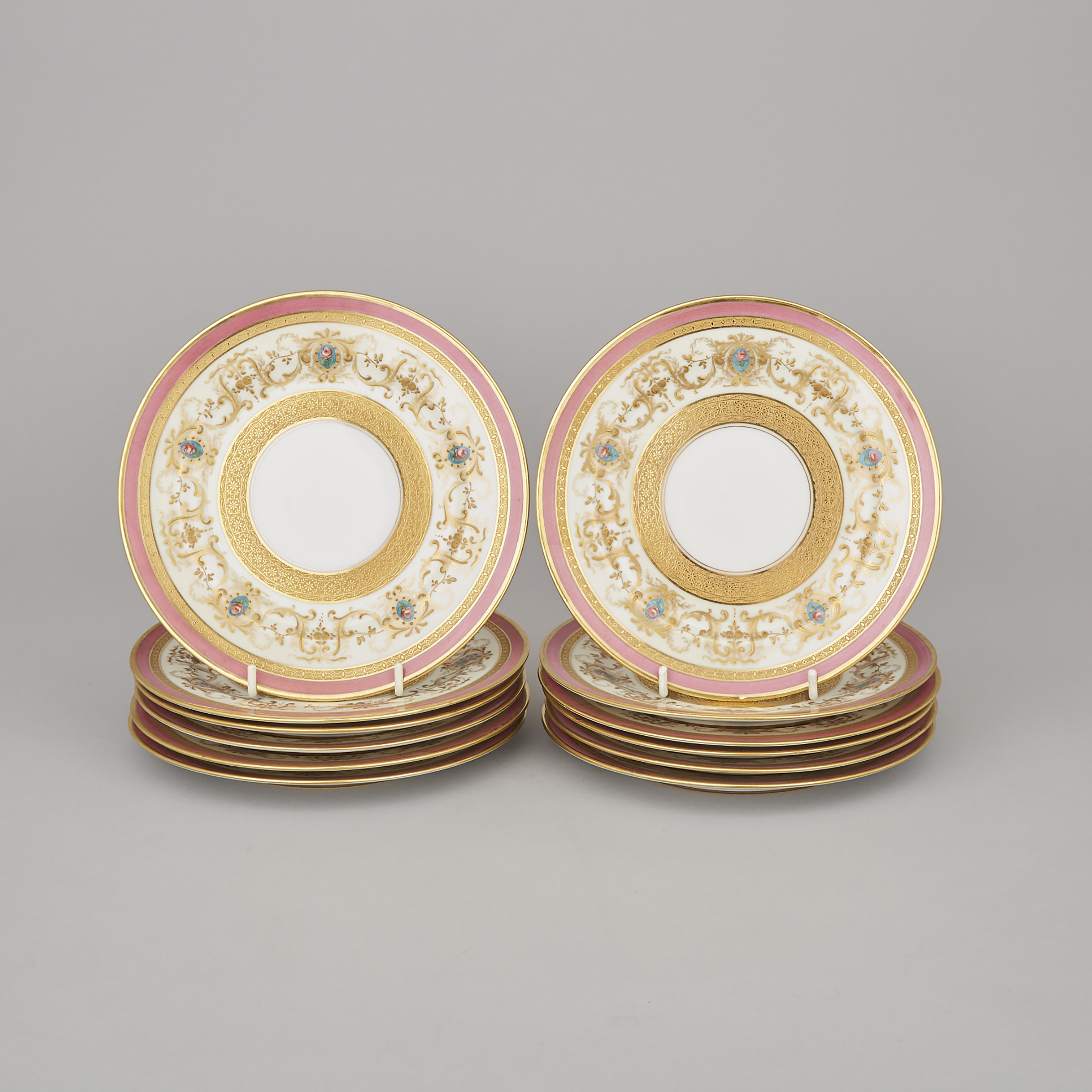 Twelve Charles Ahrenfeldt, Limoges Floral and Gilt Decorated and Pink Bordered Dessert Plates, 20th century