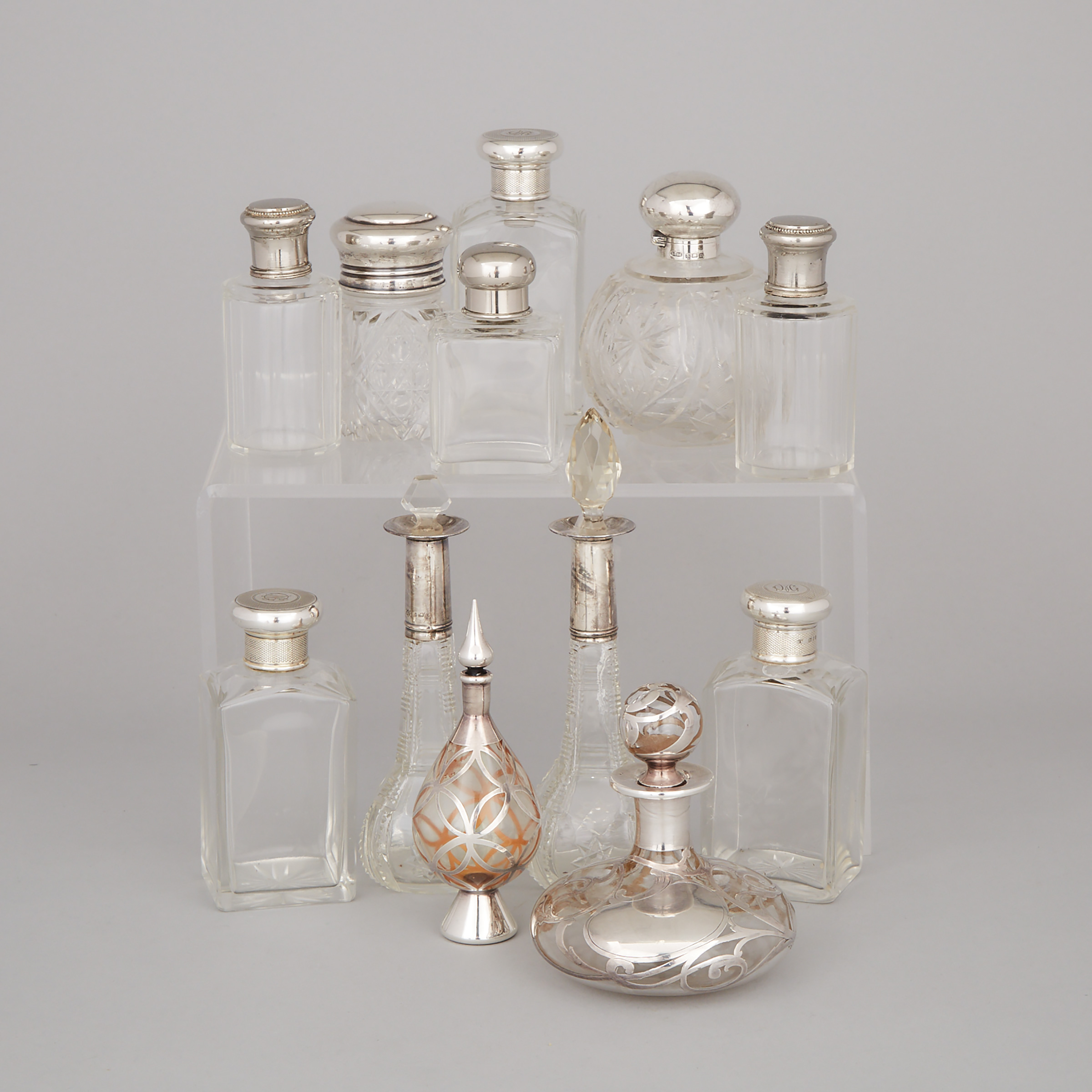 Twelve Mainly Silver Mounted Glass Perfume and Toilet Water Bottles and Jars, 20th century
