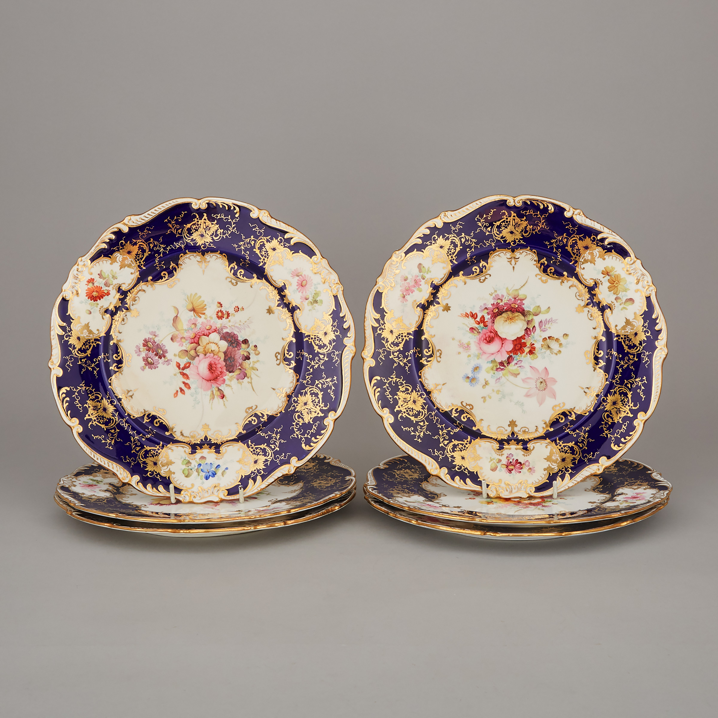 Six Coalport Floral Paneled Blue and Gilt Service Plates, Fred Howard, early 20th century