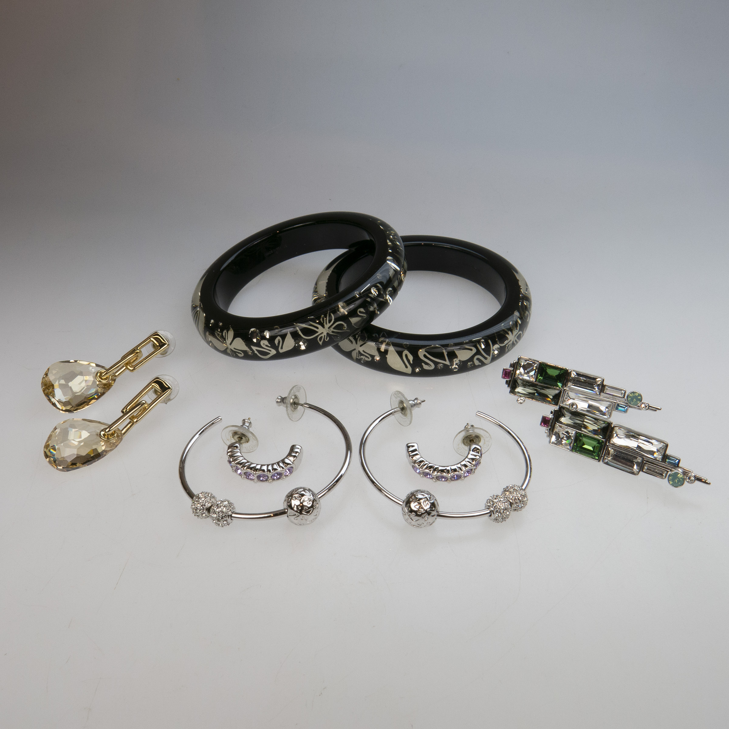 Two Swarovski Resin Bangles And Four Pairs Of Swarovski Metal And Rhinestone Earrings