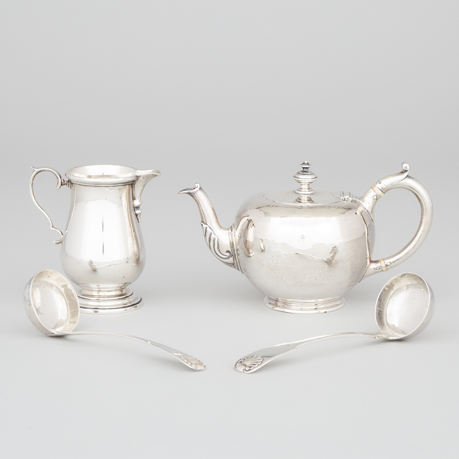 Victorian Silver Small Teapot, John Wilmin Figg, 1854, Pair of William IV Scottish Fiddle and Shell Sauce Ladles, James McKay, 1833, and a Canadian Cream Jug, Henry Birks & Sons, 1958
