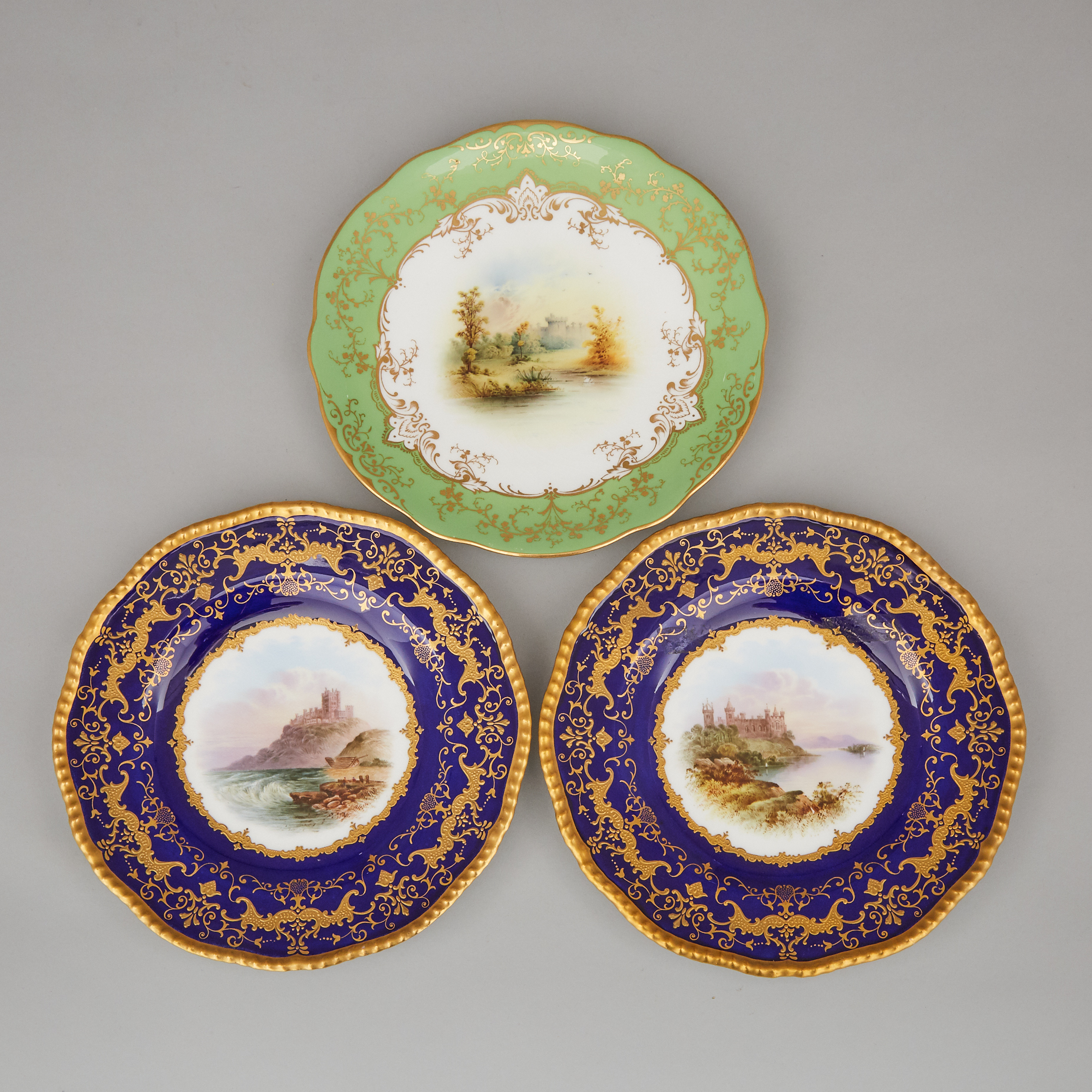 Three Coalport Blue, Green and Gilt Ground Topographical Plates, early 20th century