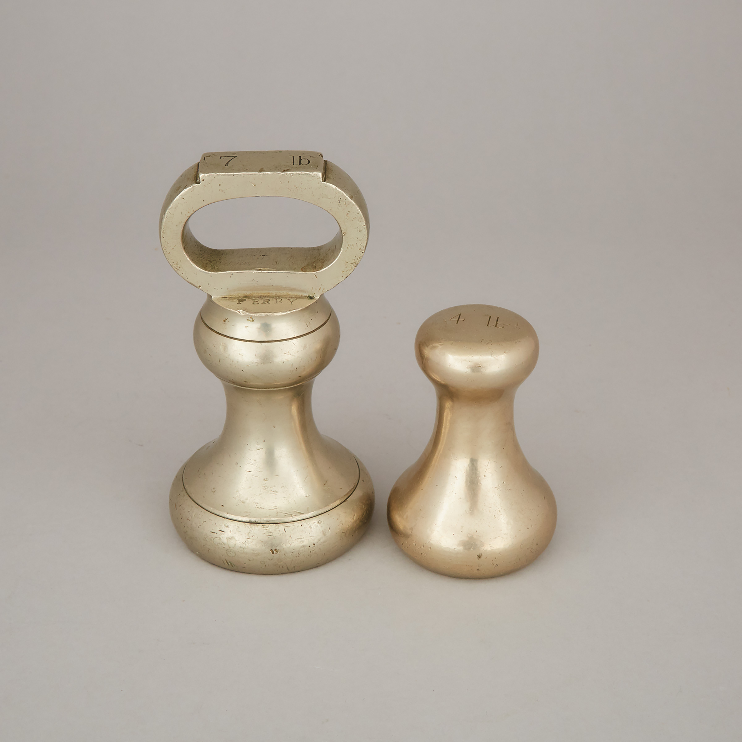 Two English Bronze Butcher's Weights, Perry & Co., London, 19th century
