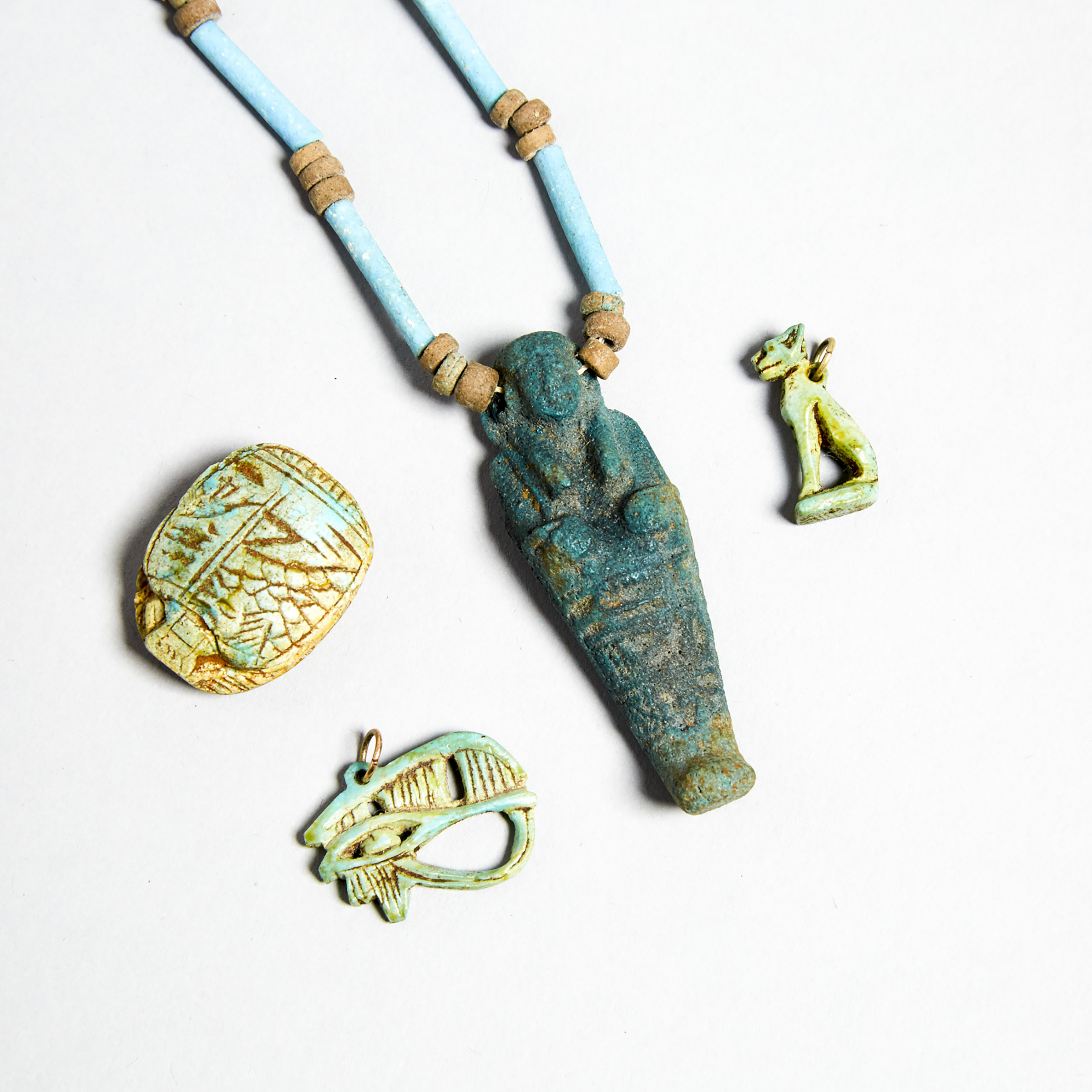 Group of Egyptian Turquoise Faience Amulets and Beads, New Kingdom to Late Period, 1550-332 B.C.