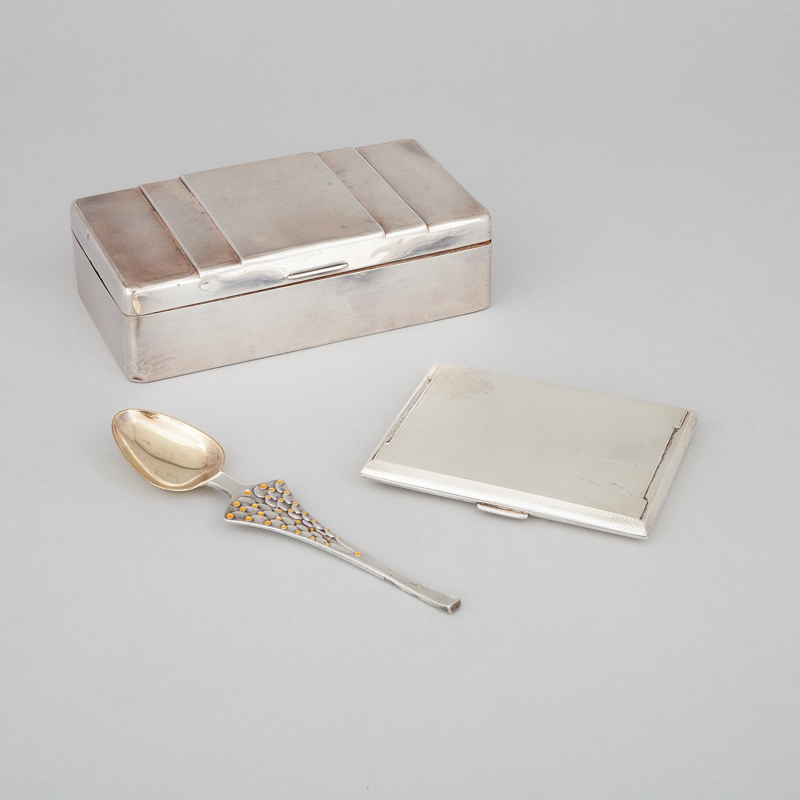 English Silver Cigarette Box, Cigarette Case and a Danish Silver and Enamel Spoon, 20th century