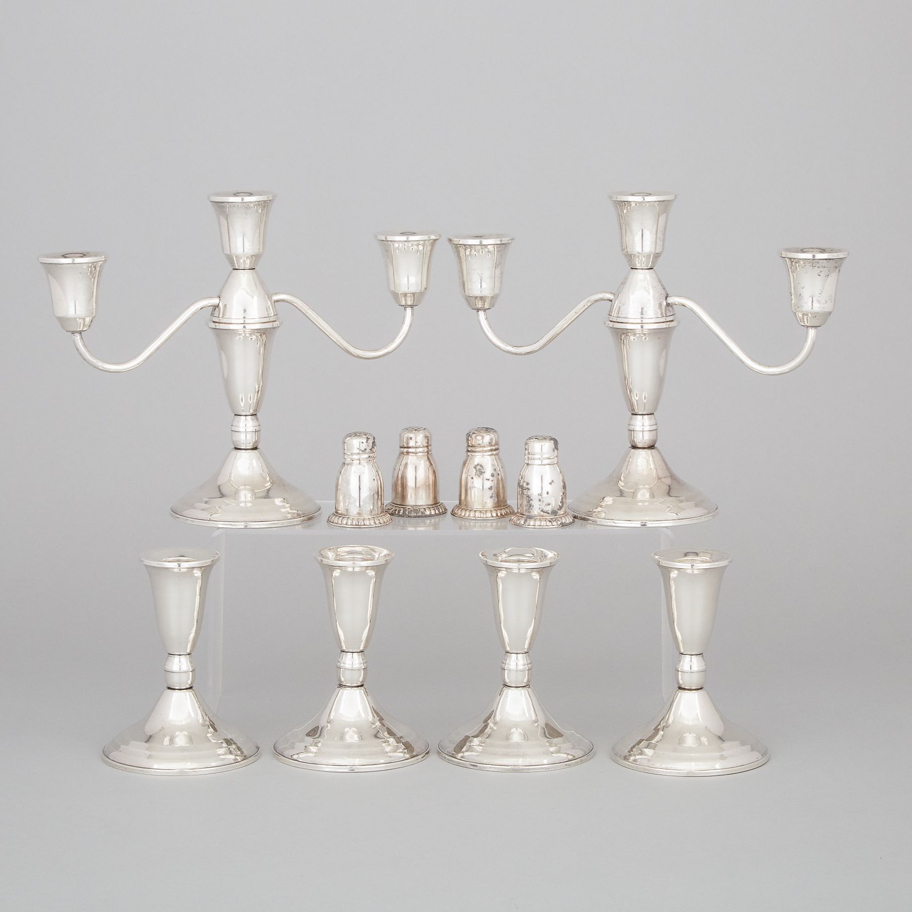 Pair of North American Silver Three-Light Candelabra and Four Low Candlesticks, Duchin, and Four Salt and Pepper Casters, Henry Birks & Sons, Montreal, Que., 20th century