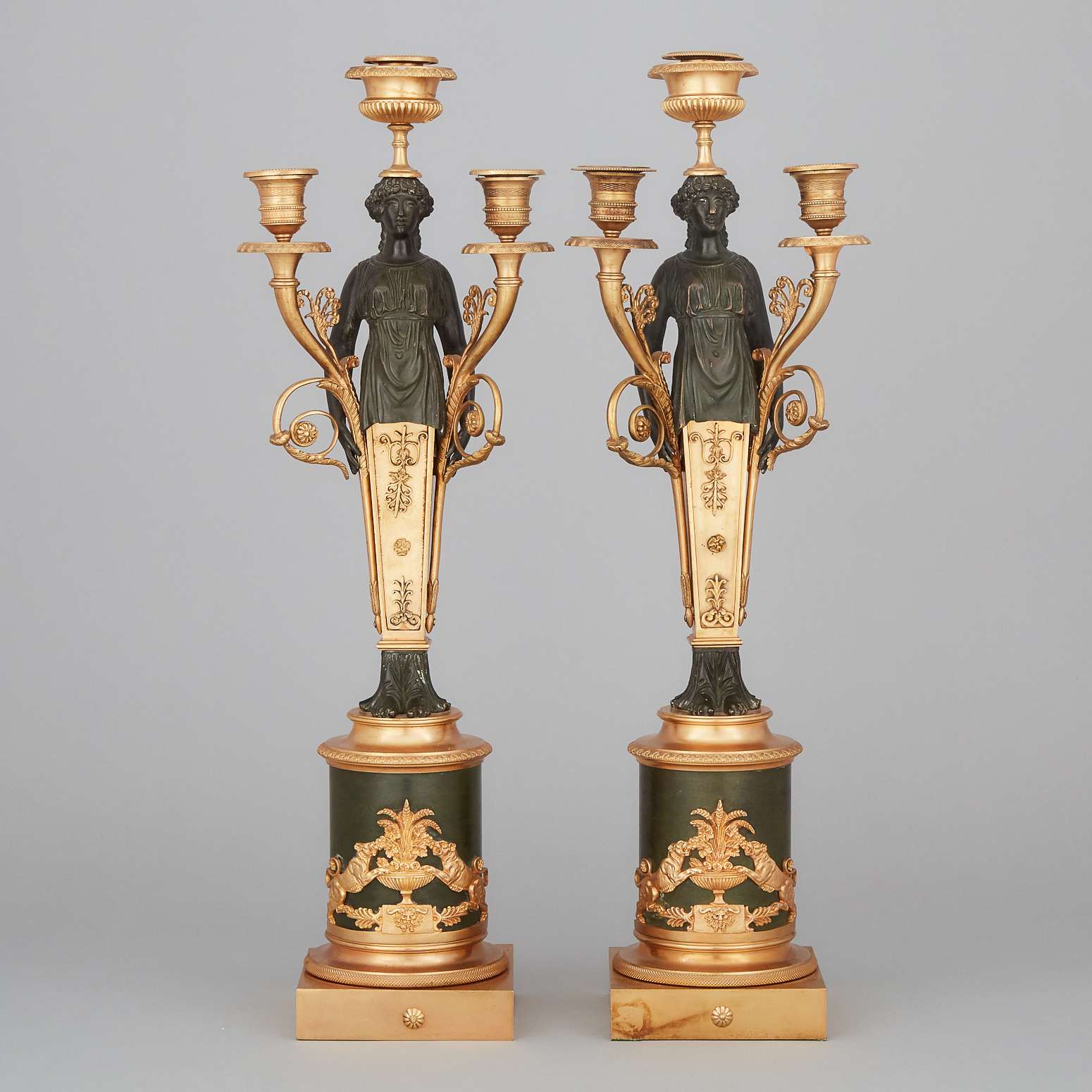 Pair of French Empire Style Gilt and Patinated Bronze Three Light Figural Candelabra, 20th century