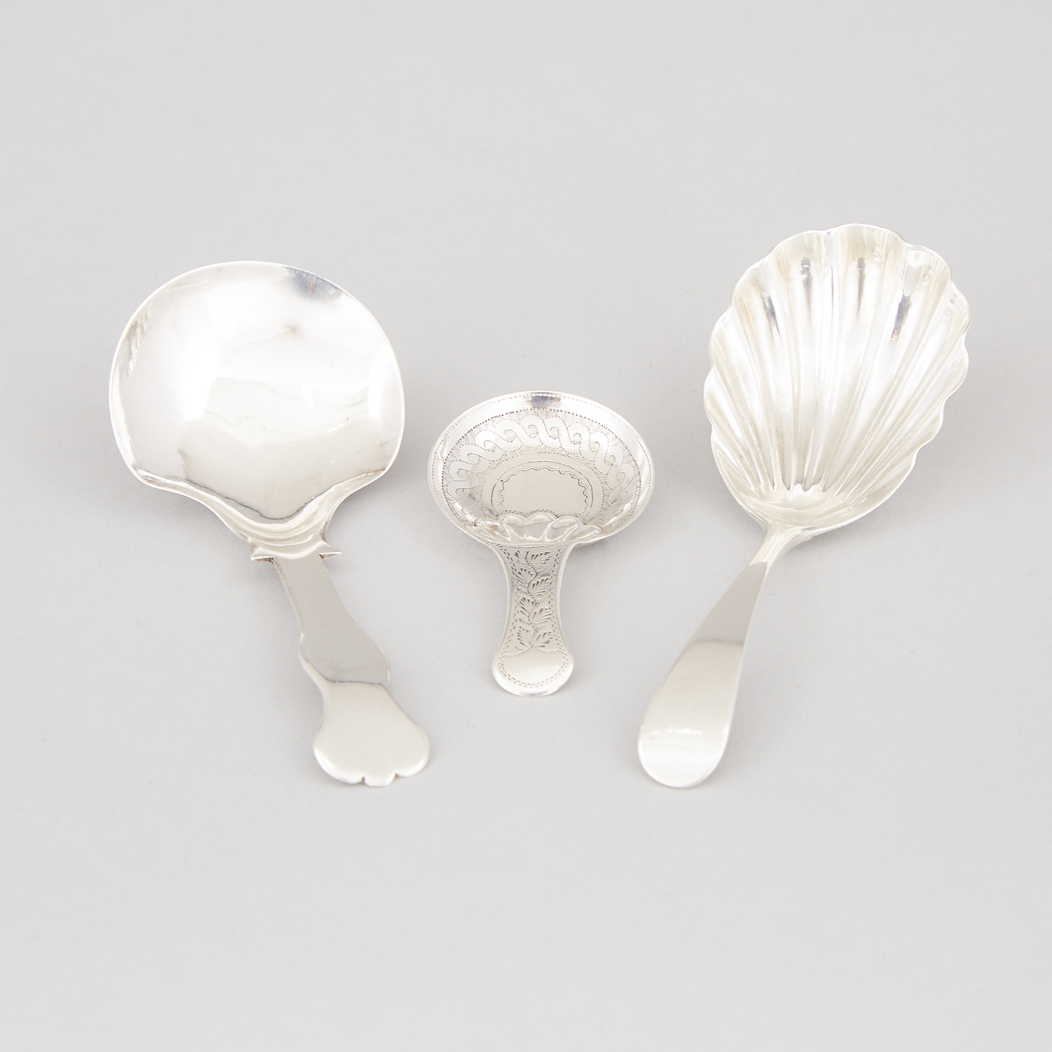 Three Georgian and Victorian Silver Caddy Spoons, Birmingham and London, 1818/1833/1892