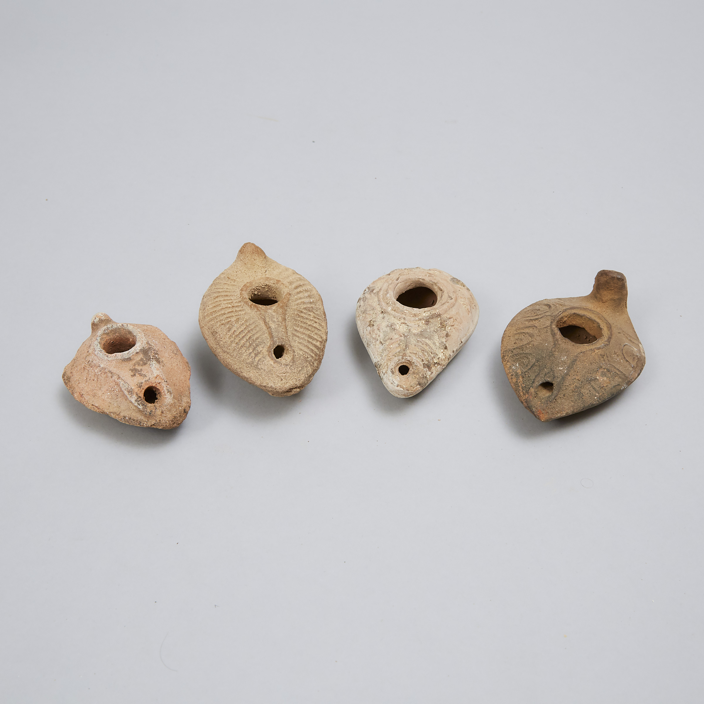 Four Roman Period Byzantine Pottery Oil Lamps, 200-500 A.D.