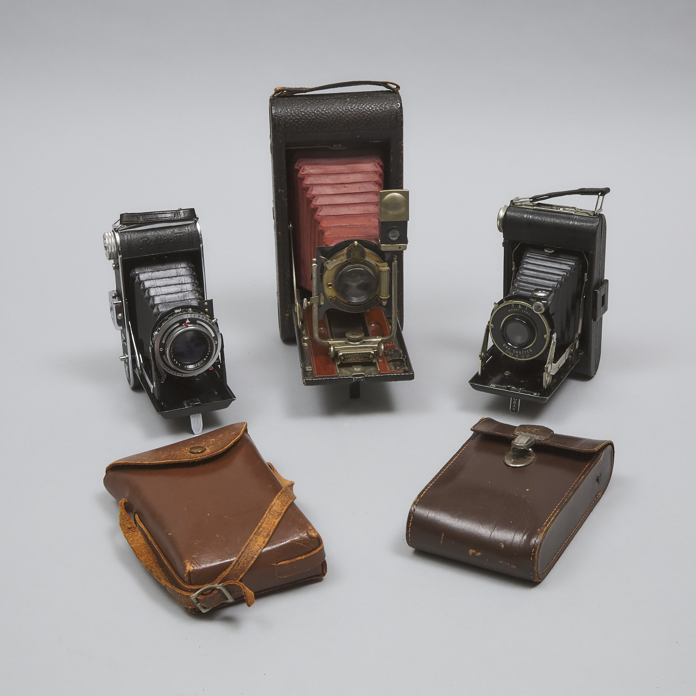 Three Folding Pocket Cameras, early to mid 20th century
