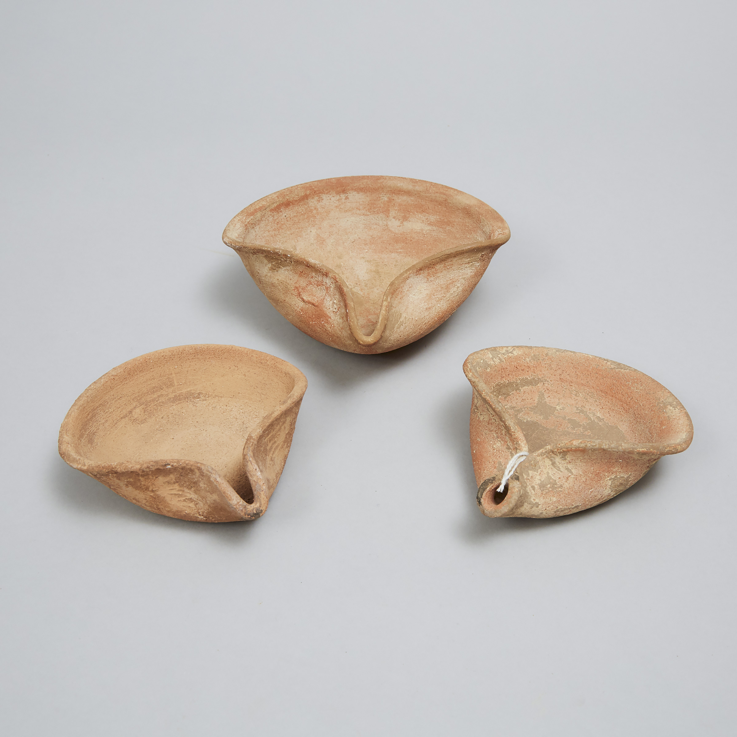 Three Iron Age Levantine-Holy Land Pottery Pinched Saucer Oil Lamps, 1200-300 B.C.