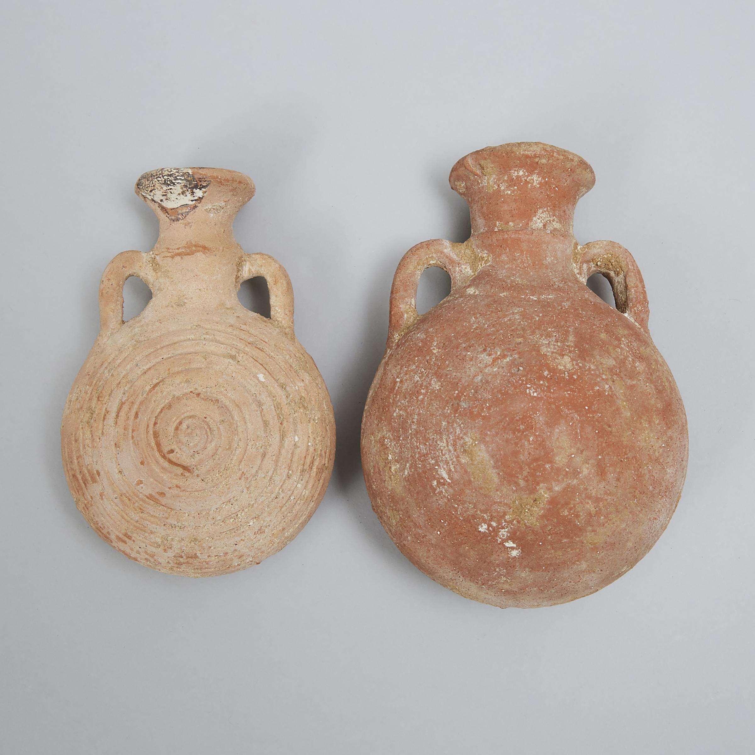 Two Levantine-Holy Land Pottery Pilgrim Flasks, 1000-500 B.C.