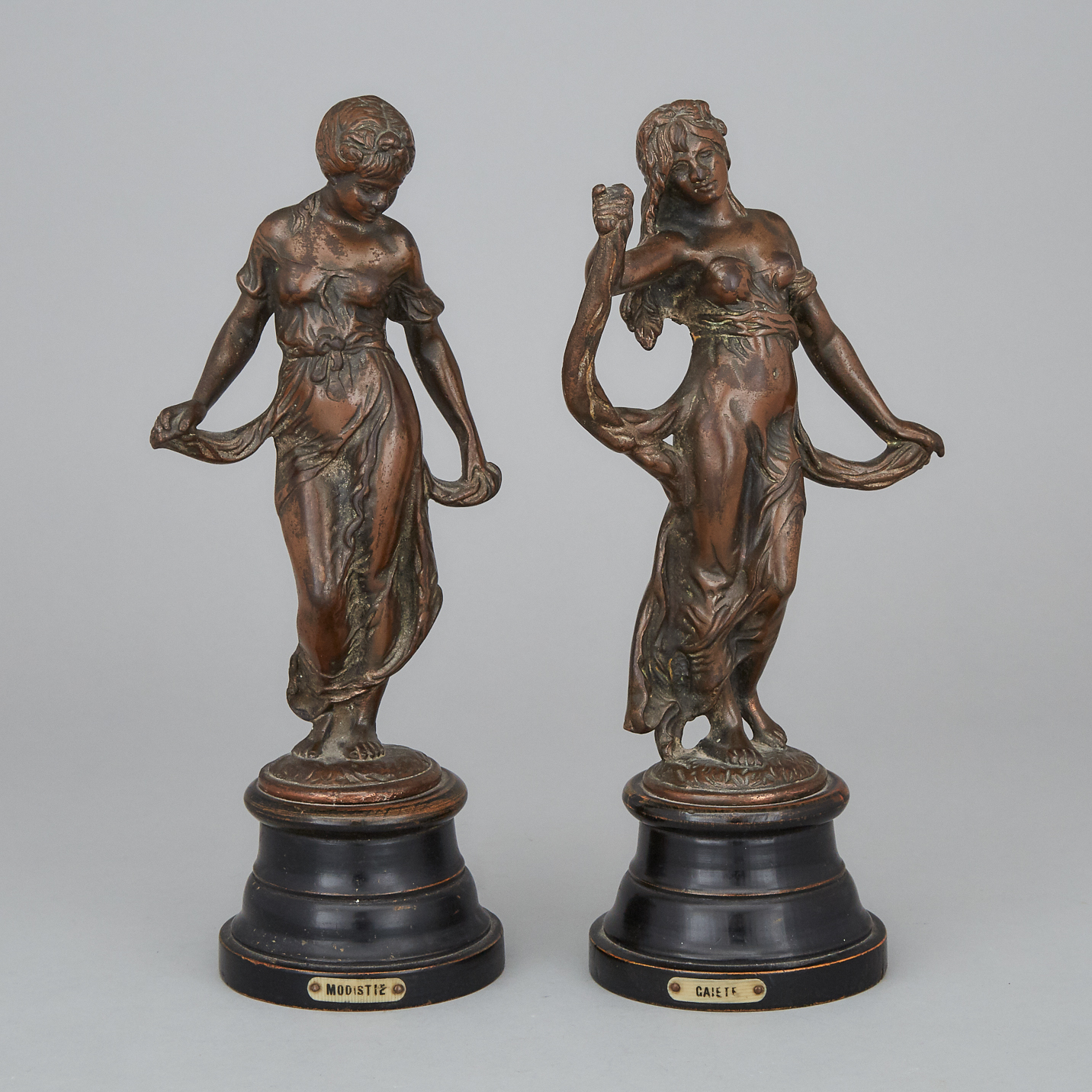Pair of Victorian Allegorical Patinated Bronze Figures Titled 'Modiste' and 'Gaieté' 19th century
