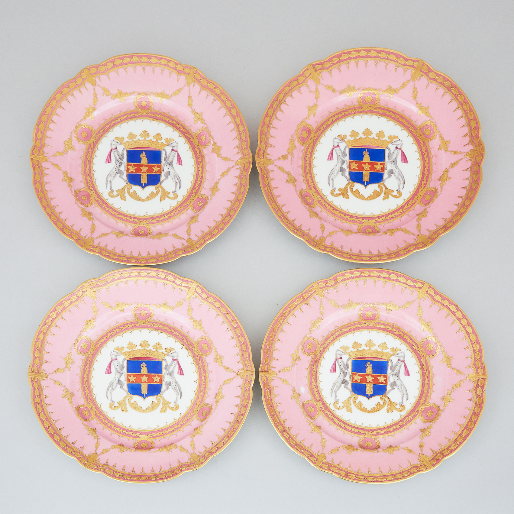 Four 'Sèvres' Pink and Gilt Ground Armorial Plates, c.1900