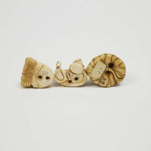 A Group of Twelve Ivory and Antler Carved Netsuke