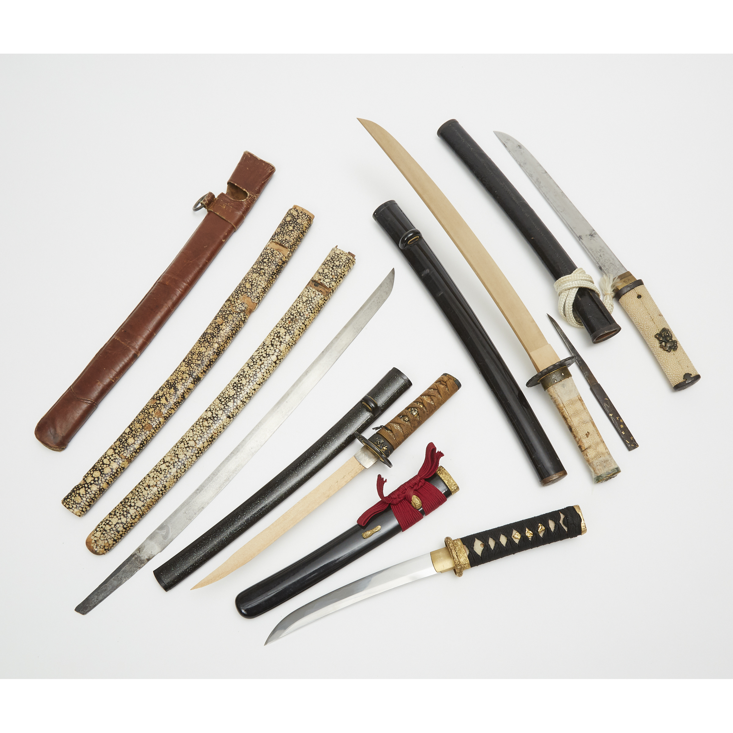 A Group of Eight Miscellaneous Japanese Sword Components
