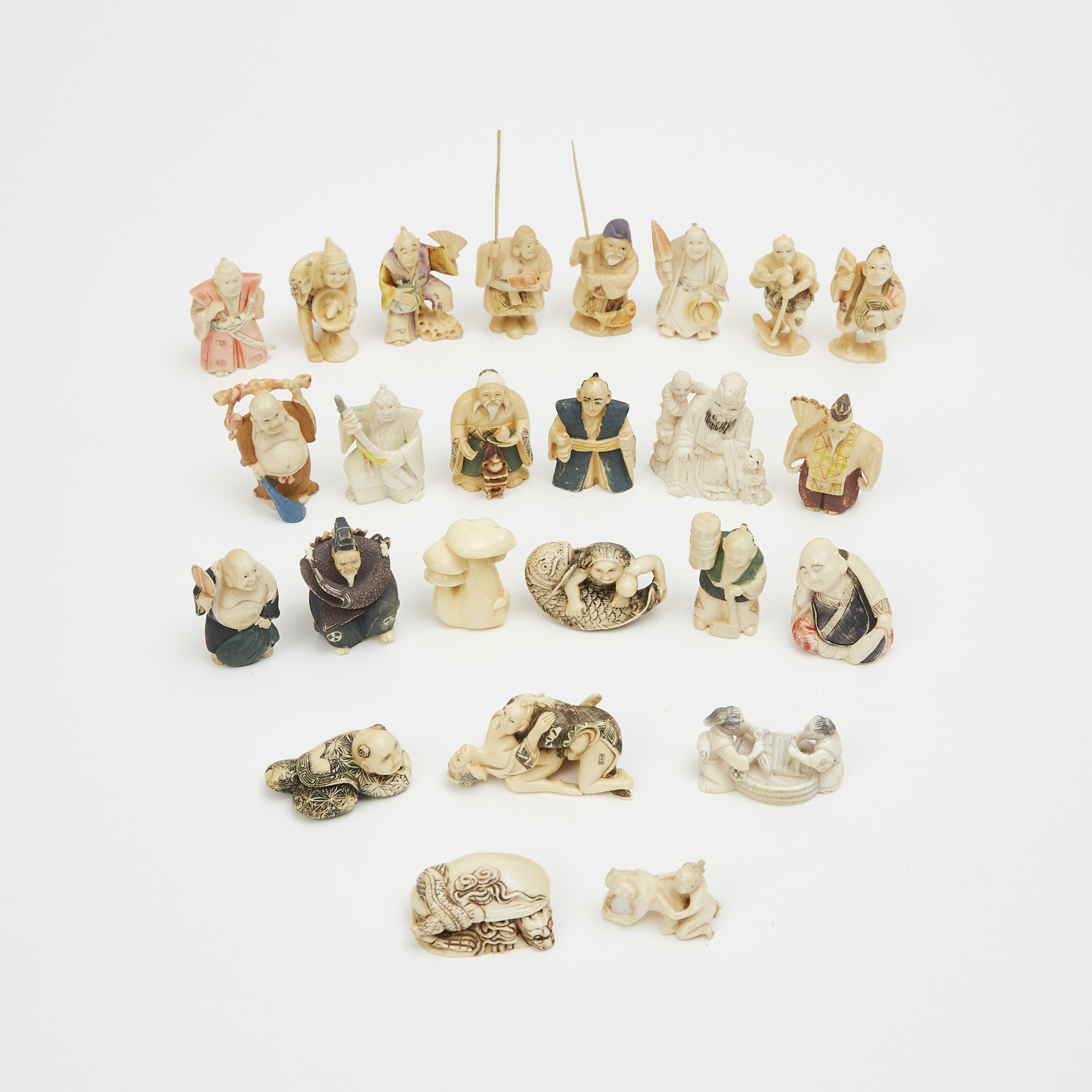 A Group of Twenty-Five Ivory Netsuke