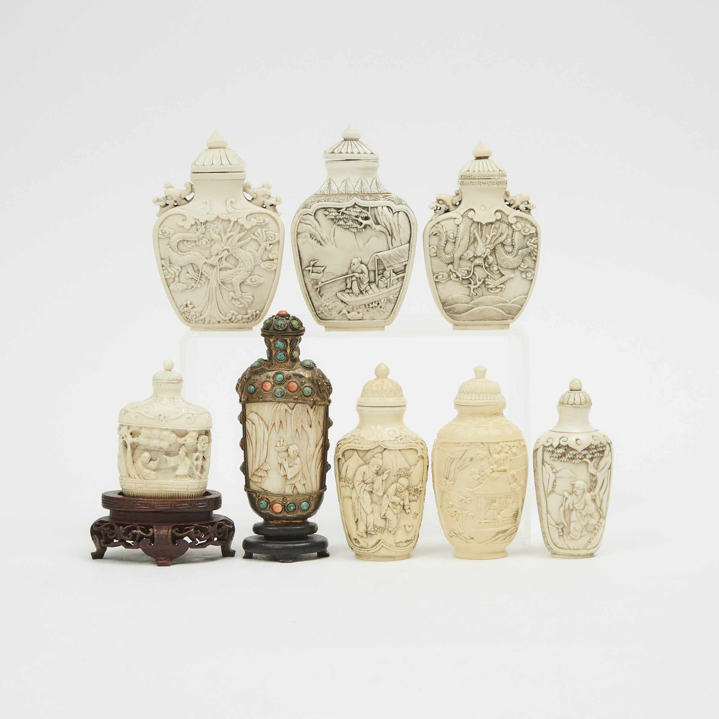 A Group of Eight Ivory and Bone Carved Snuff Bottles