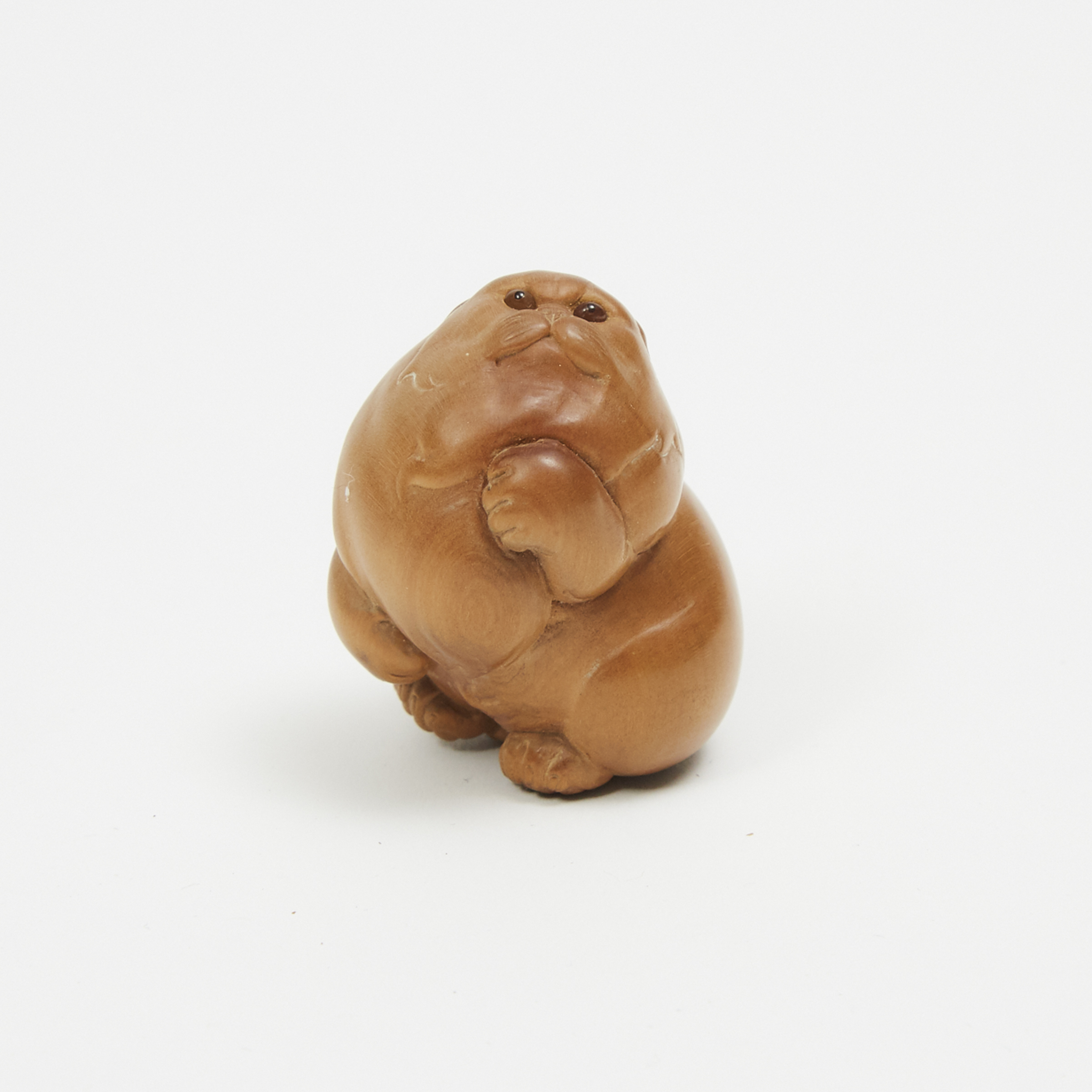A Wood Carved Netsuke of a Cat, Signed