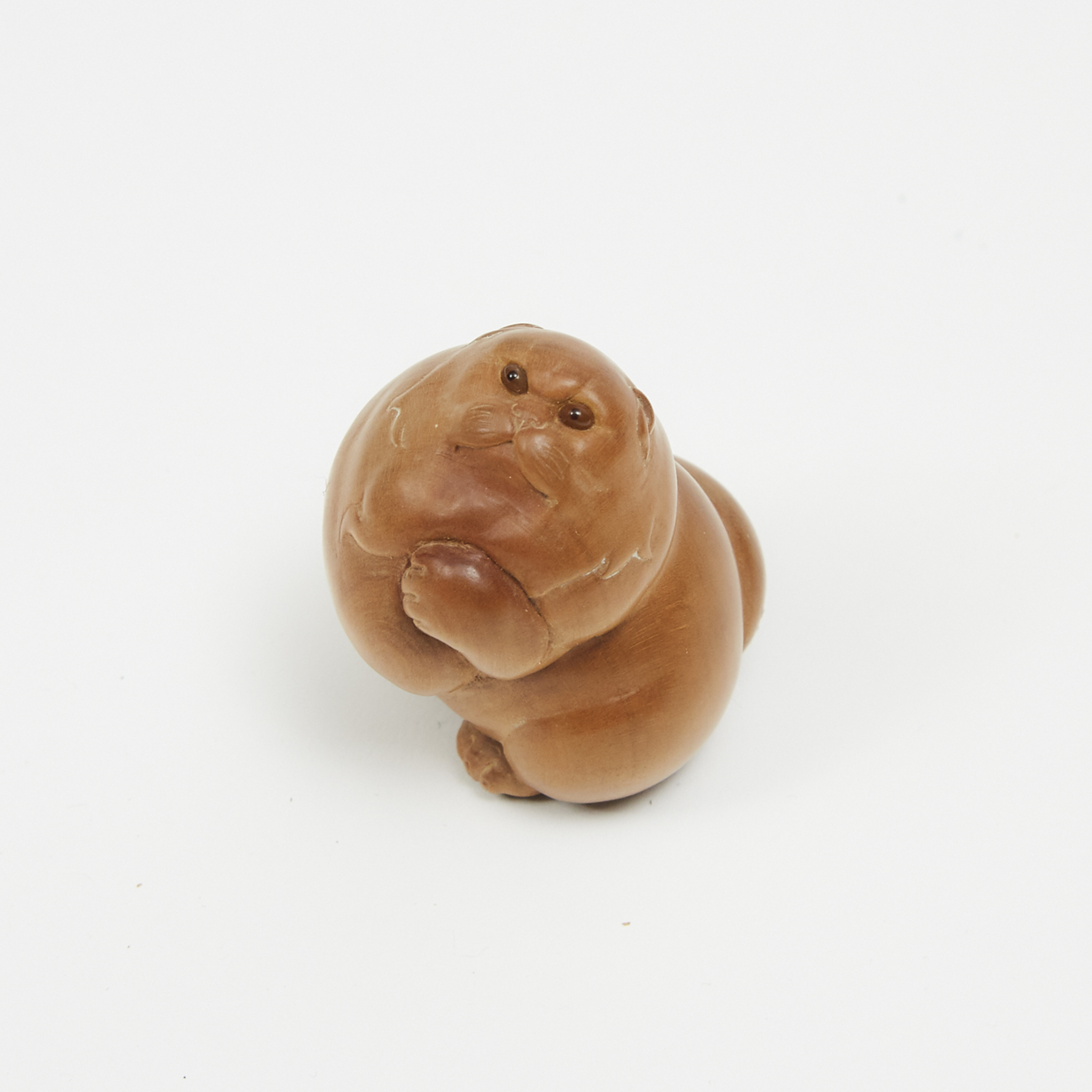 A Wood Carved Netsuke of a Cat, Signed