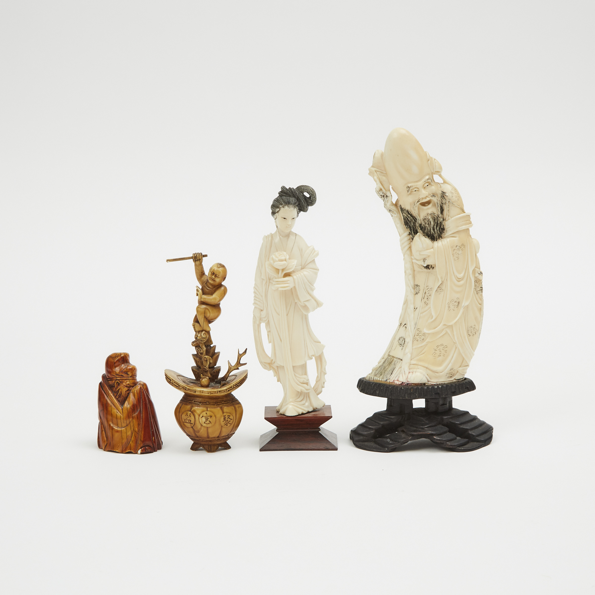 A Group of Four Chinese Ivory Carved Figures, 19th/Early 20th Century