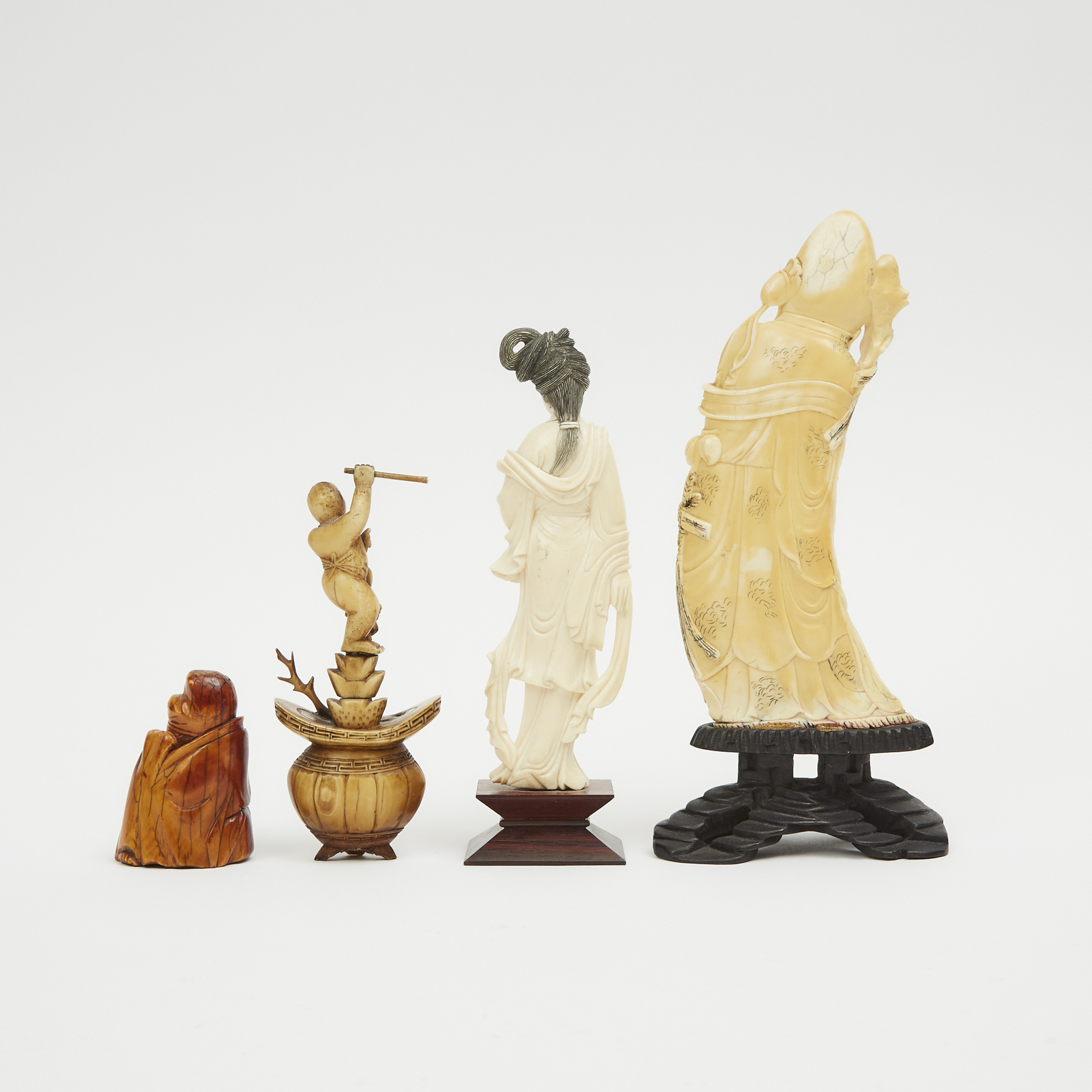 A Group of Four Chinese Ivory Carved Figures, 19th/Early 20th Century