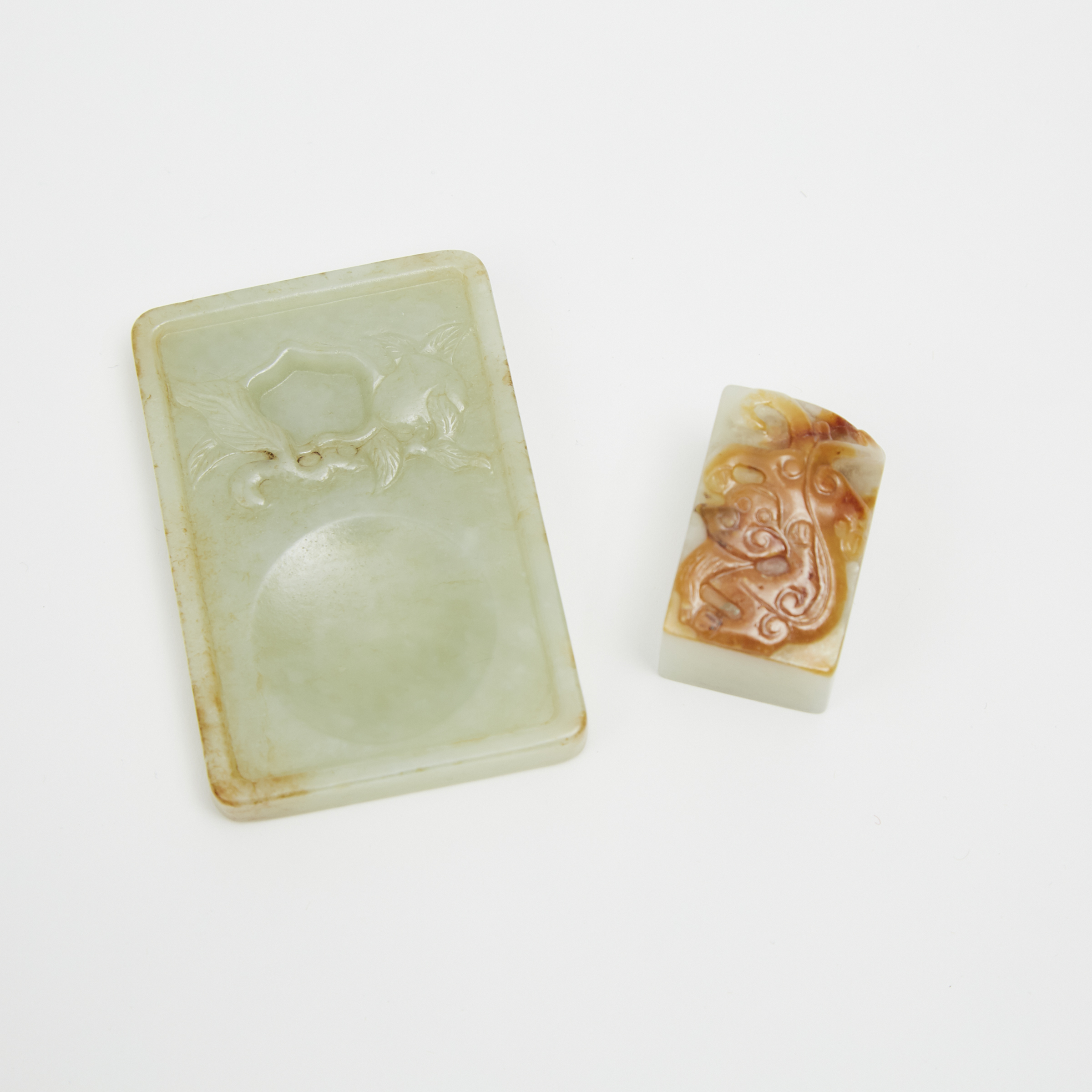 A Pale Celadon Jade Inkstone and a White Jade and Russet 'Chi-Dragon' Seal