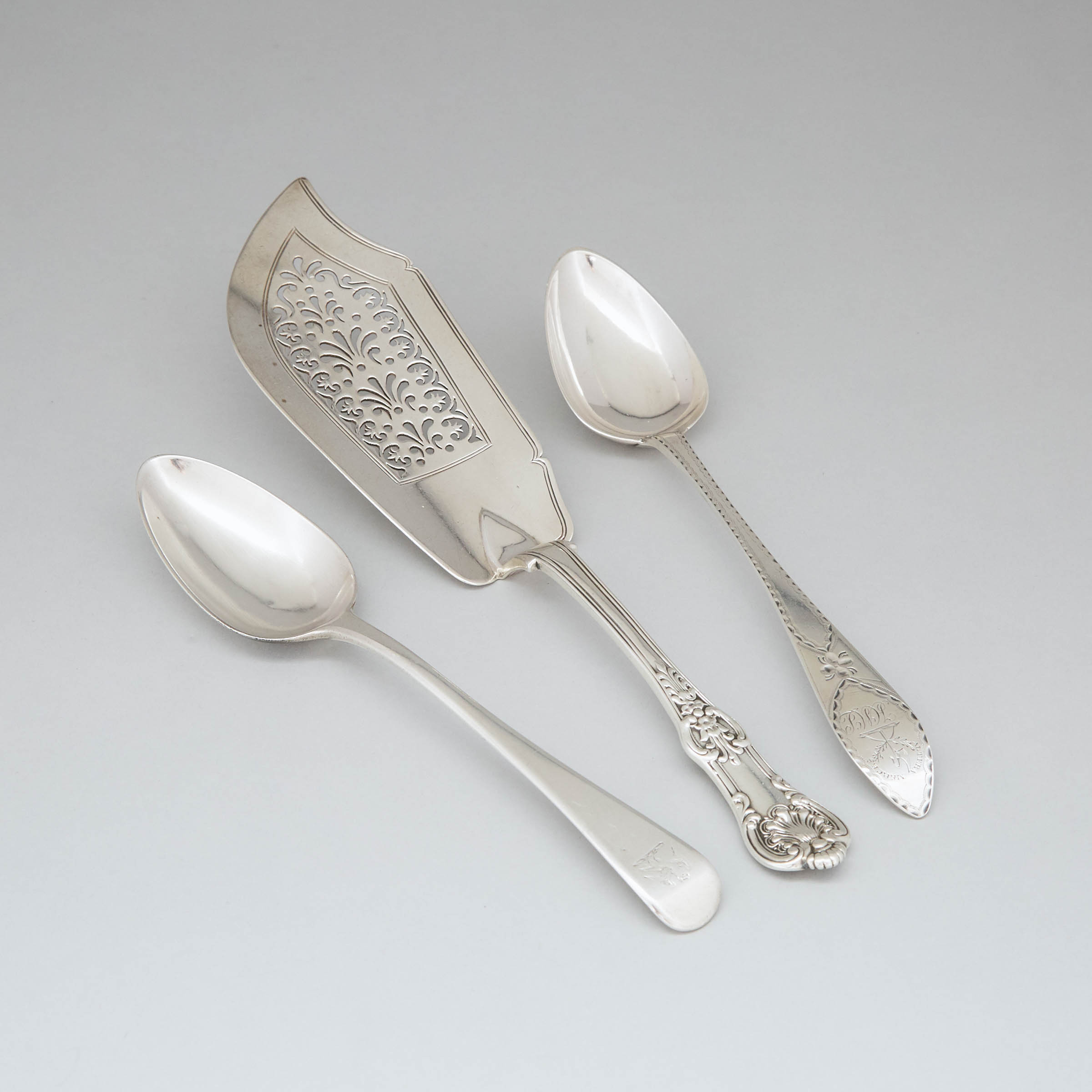 Two George III Silver Table Spoons, Francis Howden, Edinburgh, 1790 and George Smith III & William Fearn, London, 1794 and a Victorian Queens Pattern Fish Slice, William Theobalds & Robert Atkinson, London, 1839