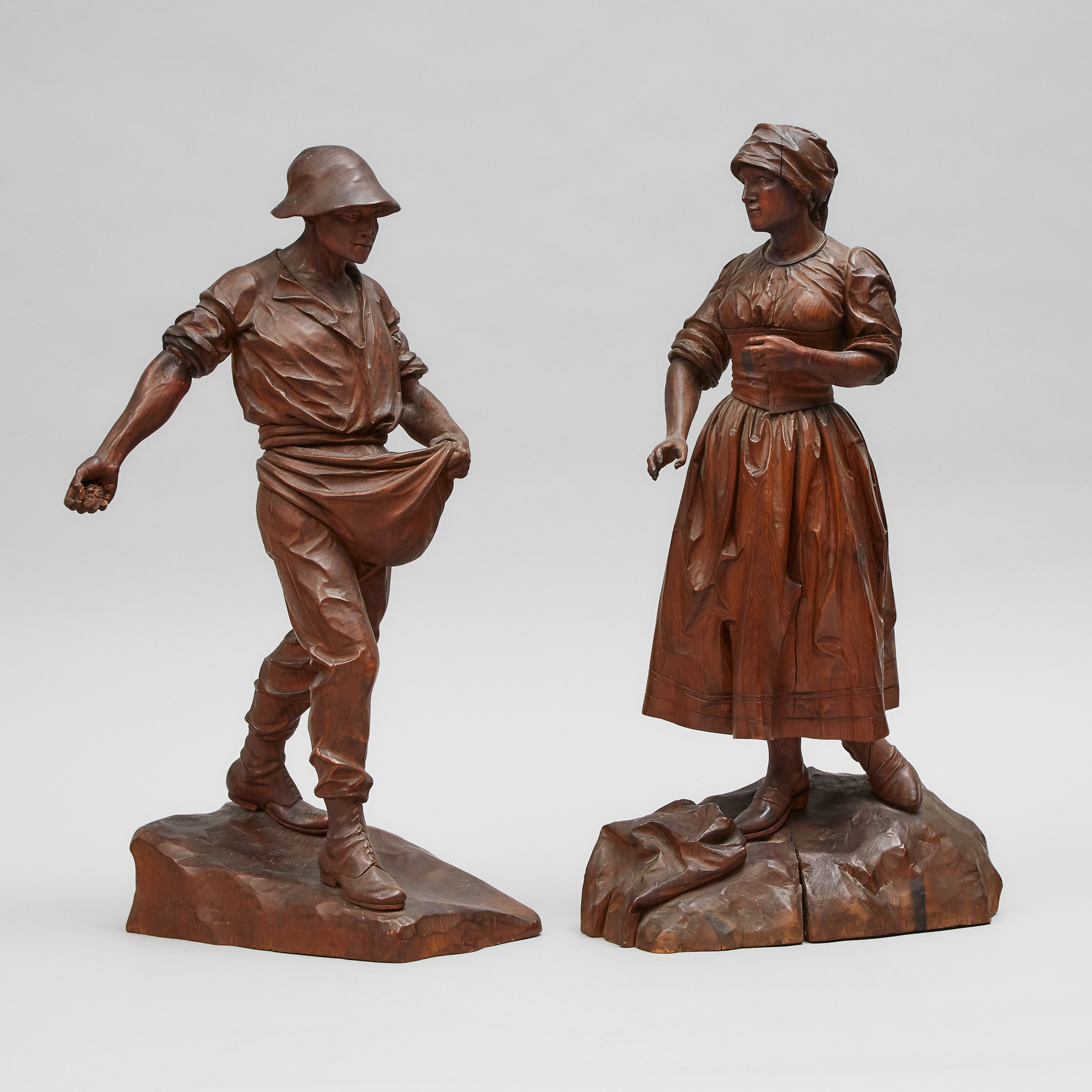 Pair of South German Carved Figures of a Peasant Couple, early 20th century