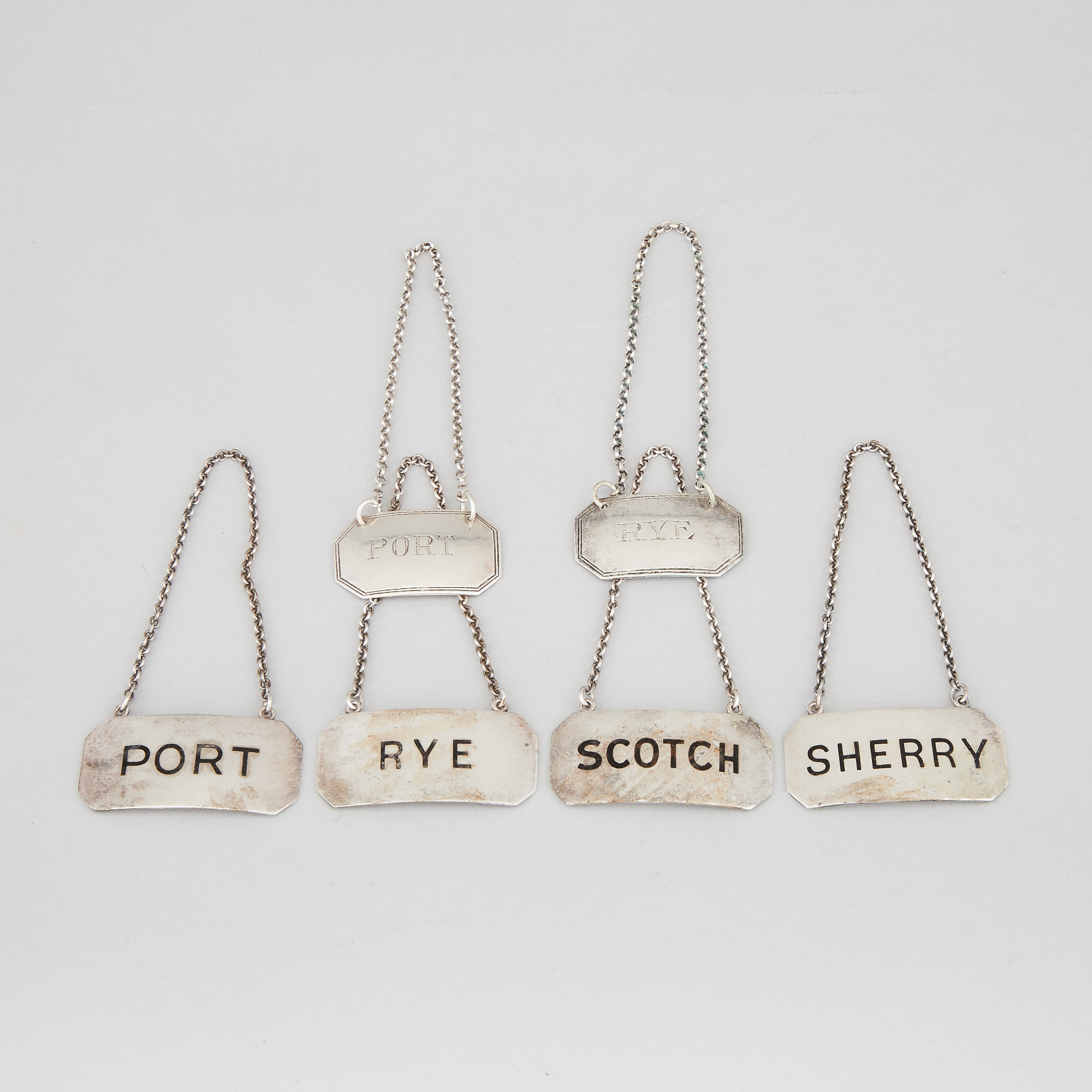 Pair of English and Four Canadian Silver Wine and Spirit Labels, Harry Freeman, London, 1913 and Roden Bros., Toronto, 20th century