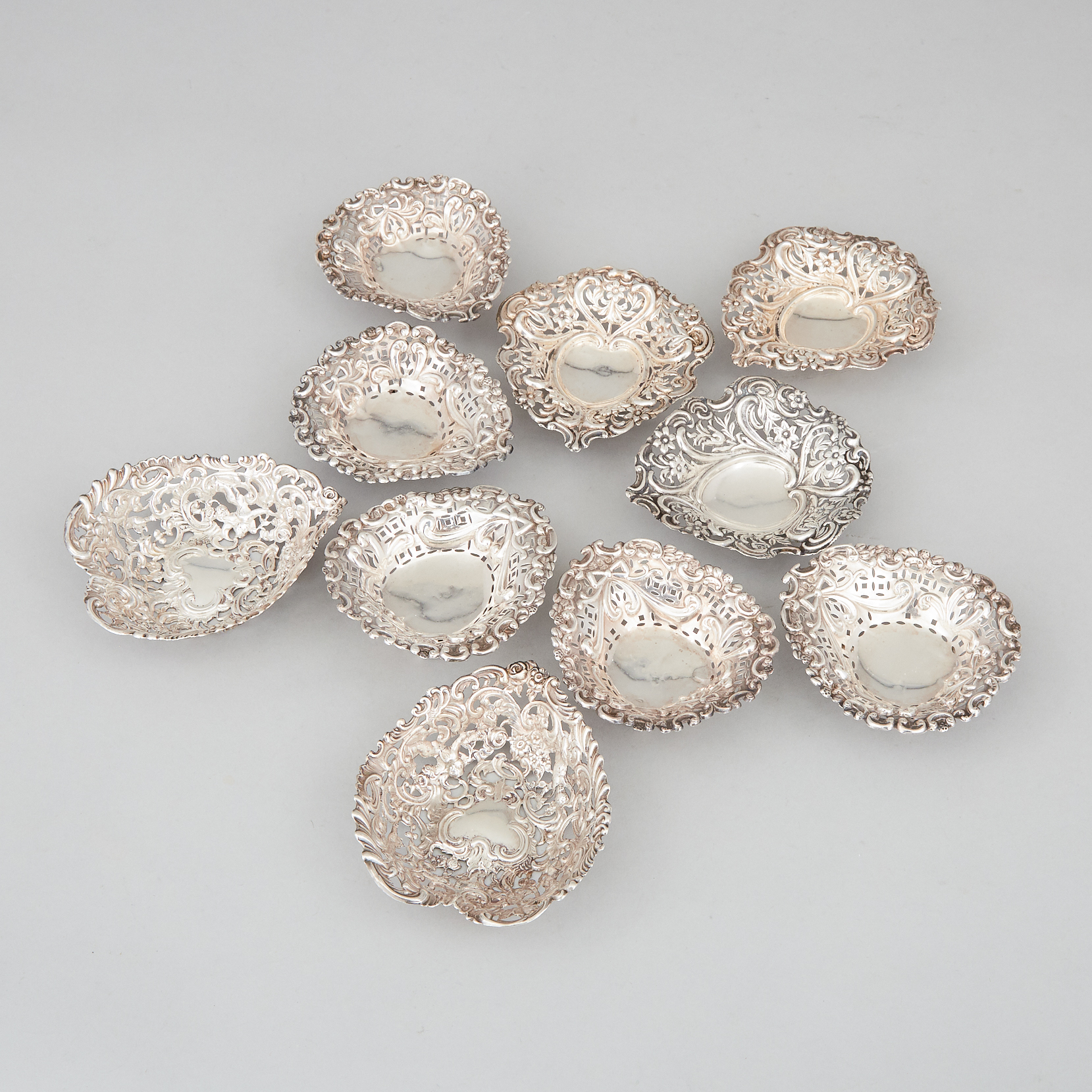 Ten Late Victorian Silver Pierced Heart-Shaped Bonbon Dishes, London and Birmingham, 1894-97