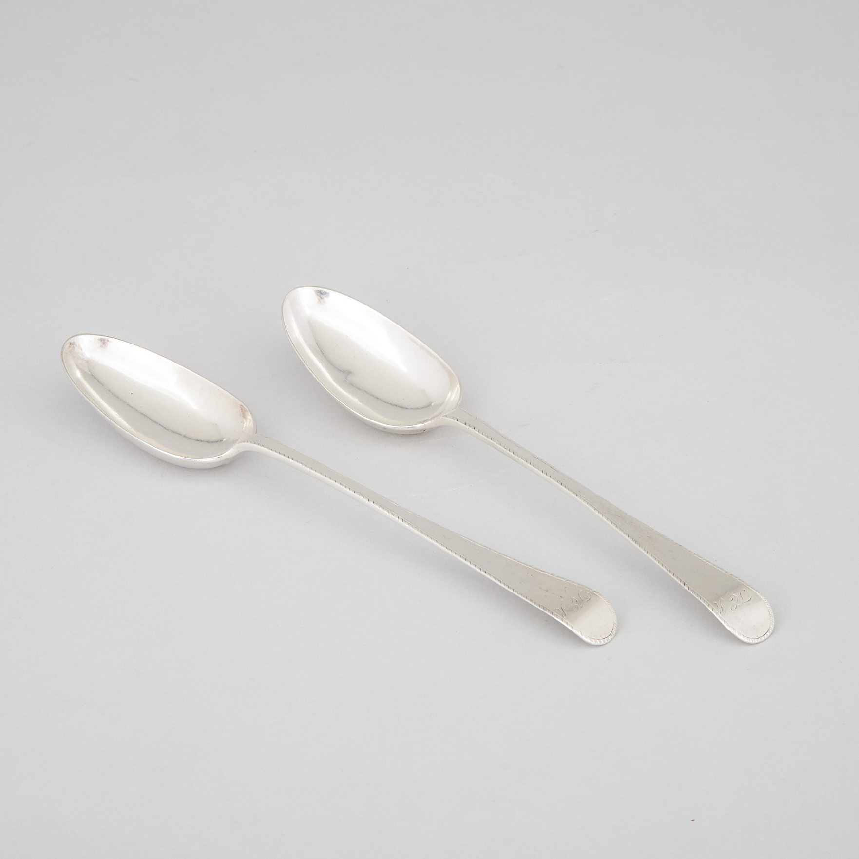 Pair of American Silver Feather-Edged Old English Pattern Table Spoons, Thomas You, Charleston, S.C., c.1775