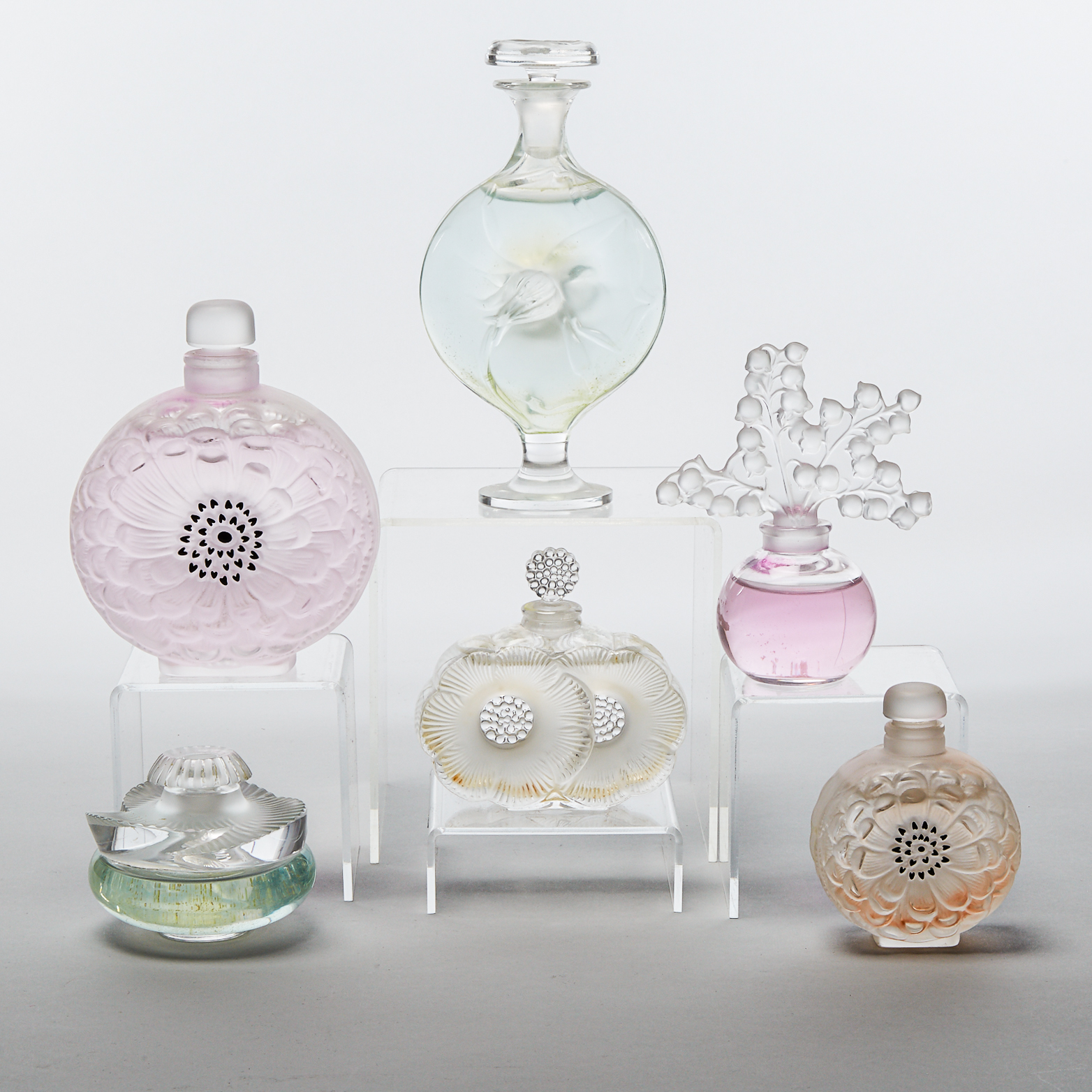 Six Lalique Moulded and Frosted Glass Perfume Bottles, post-1978