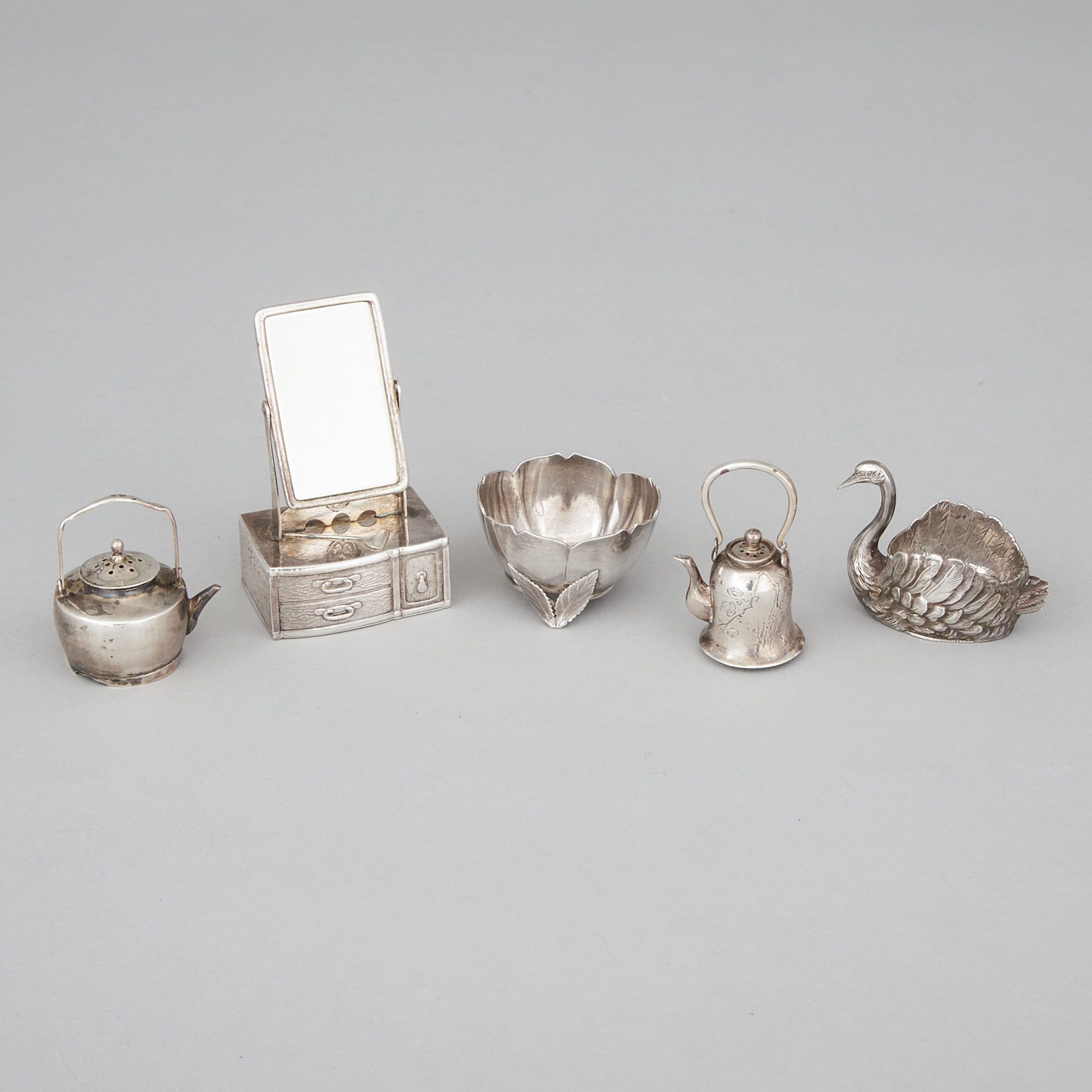 Three Asian Silver Novelty Pepper Casters and Two Salt Cellars, early 20th century