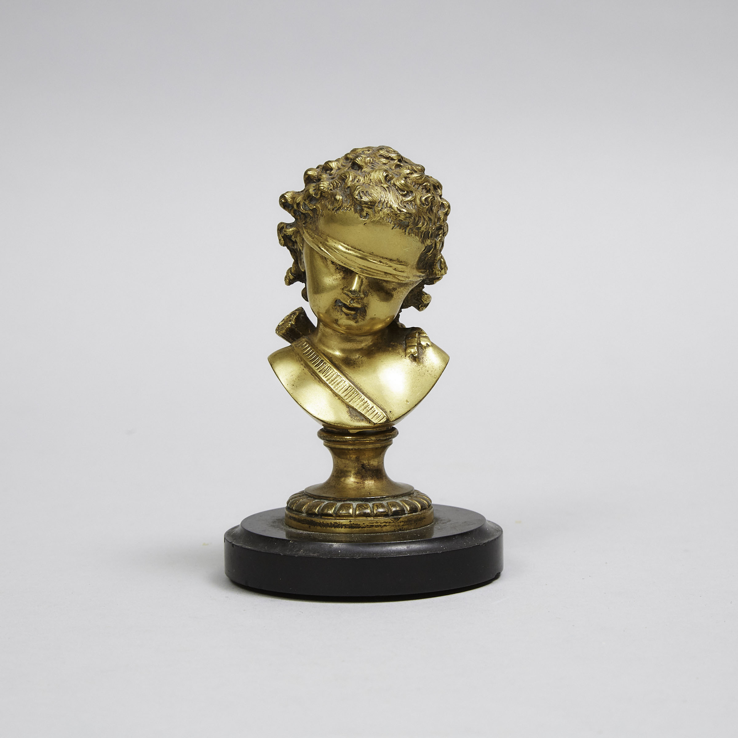 Small French Gilt Bronze Desk Bust of Blindfolded Cupid, late 19th century