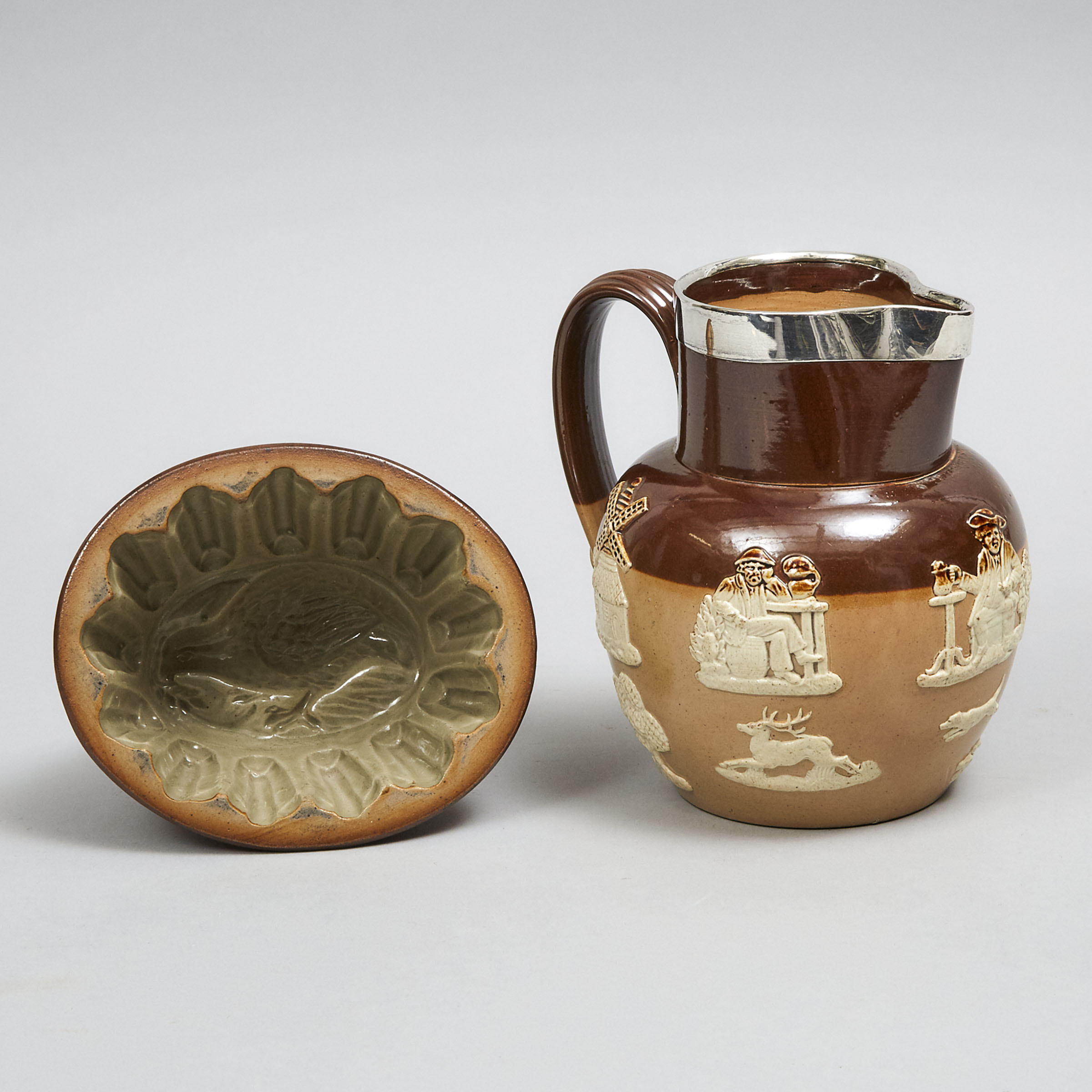 Doulton Lambeth Silver Mounted Stoneware Jug and an English Stoneware Jelly Mould, late 19th century