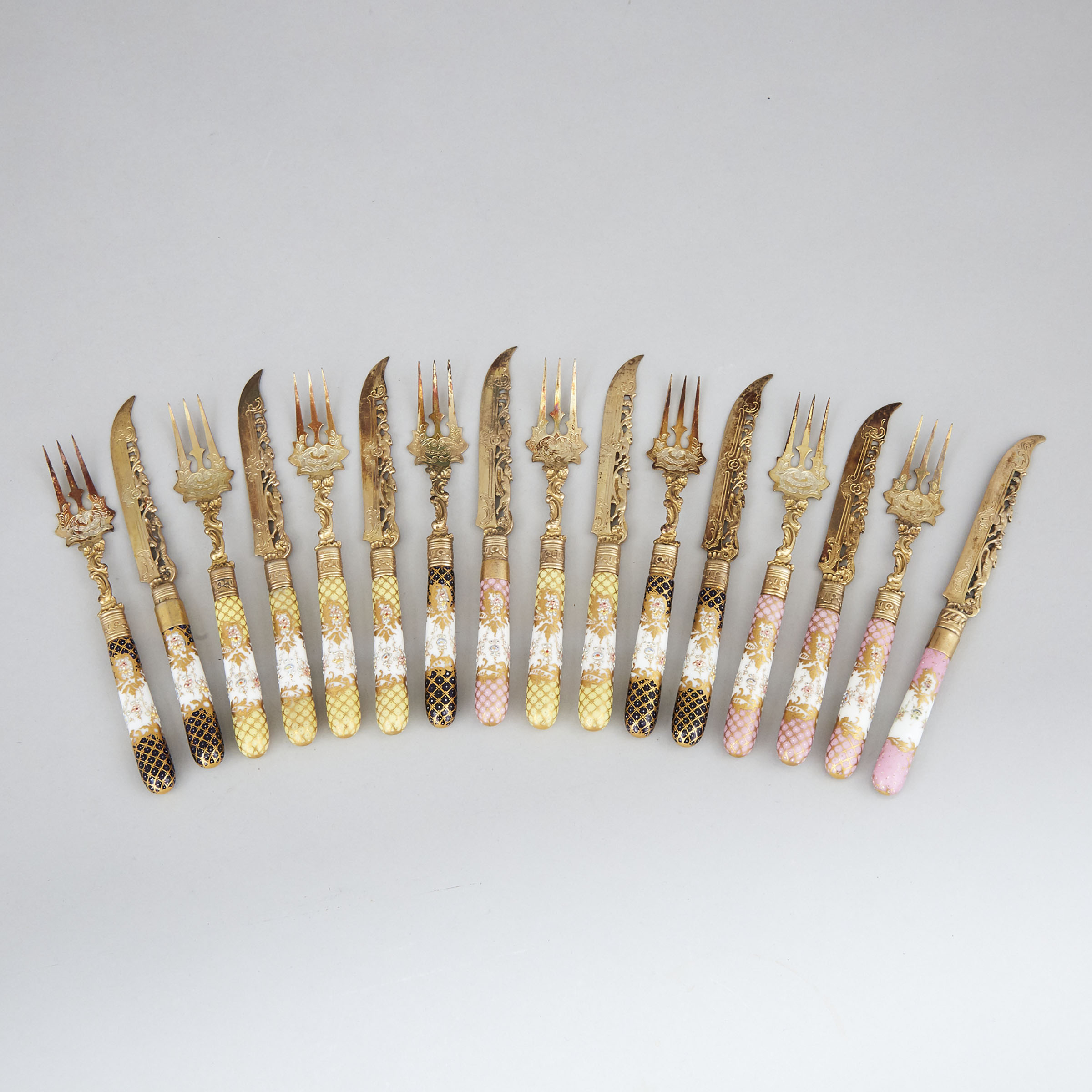 Eight German Porcelain Handled Silver-Gilt Dessert Knives and Eight Forks, c.1900