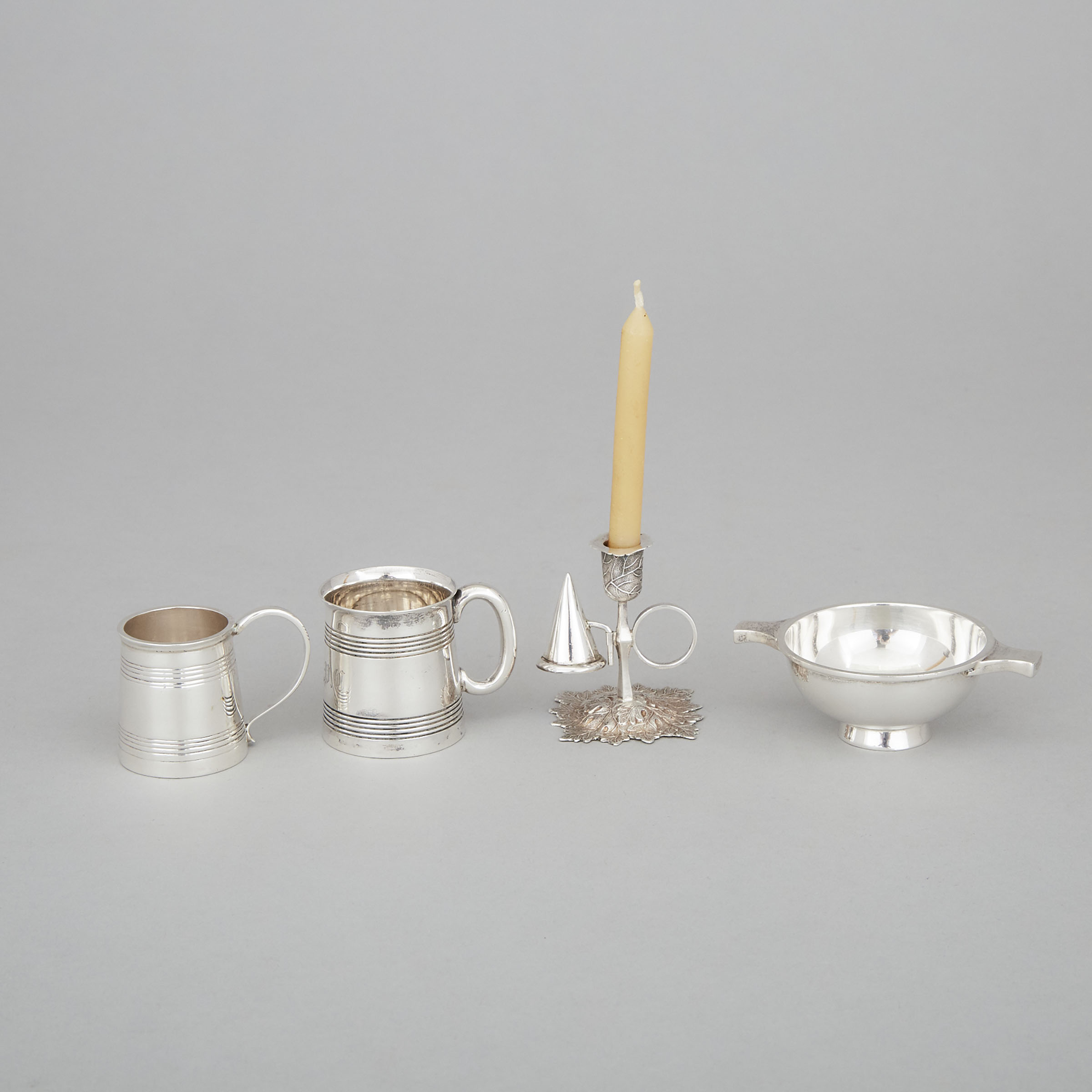 Victorian Silver Miniature Chamberstick, Yapp & Woodward, Birmingham, 1855, Two Miniature Mugs, Job Frank Hall, London, 1894 and William Aitken, Chester, 1900, and a Scottish Small Quaich, Hamilton & Inches, 1950