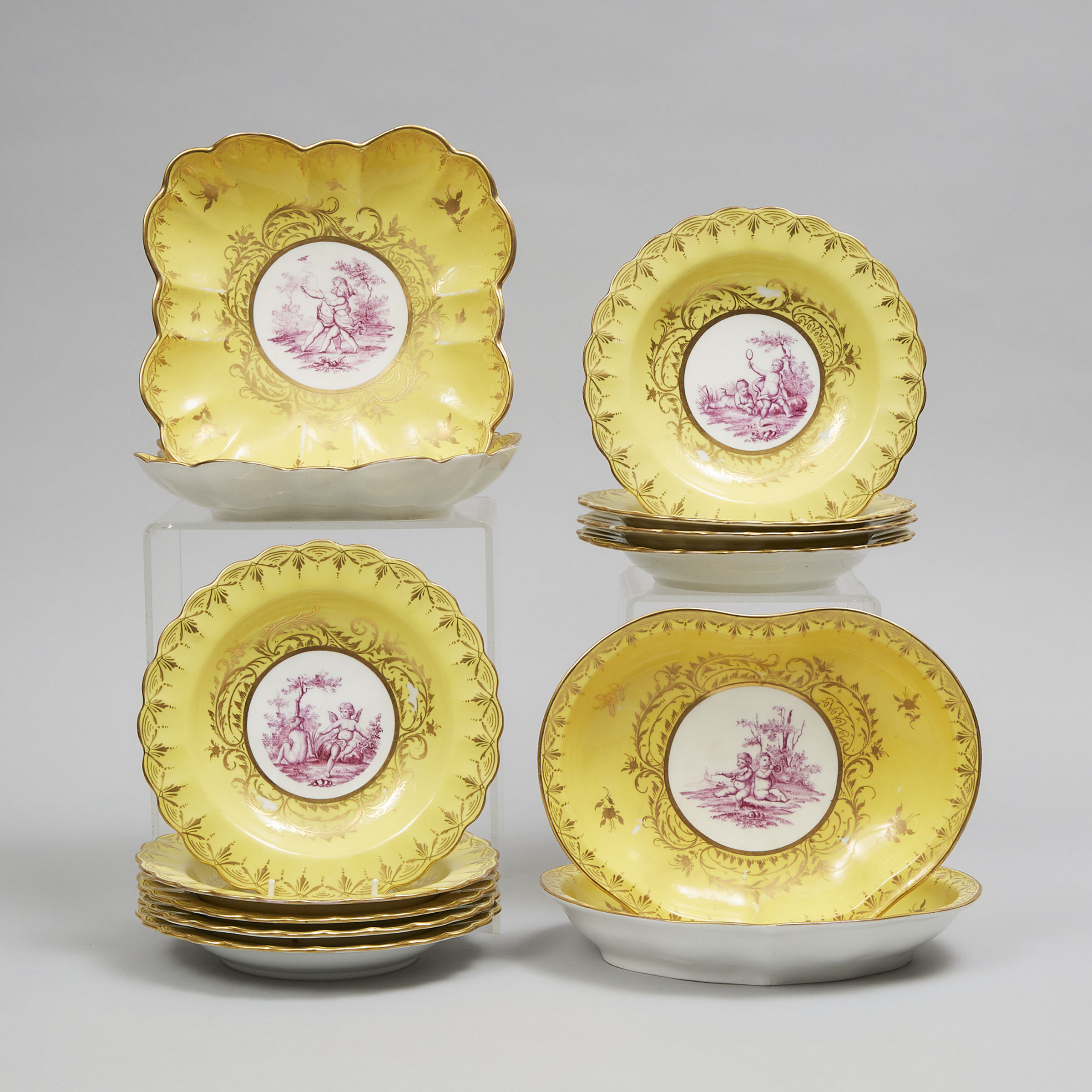Continental Porcelain Puce Camaïeu Yellow-Ground Dessert Service, 19th century