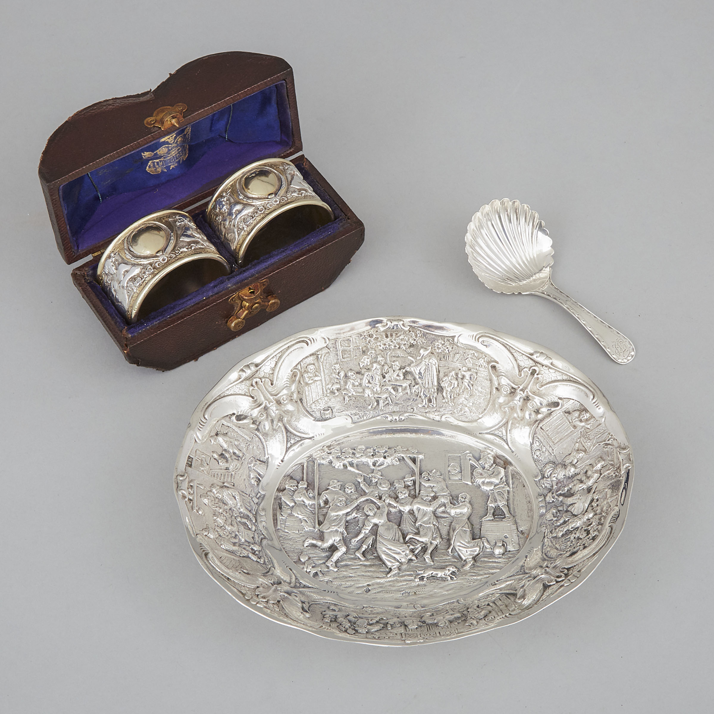 George III Silver Caddy Spoon, John Emes, London, c.1800, Later Dutch Silver Oval Dish and a Cased Pair of Silver Plated Napkin Rings, Elkington & Co. late 19th century