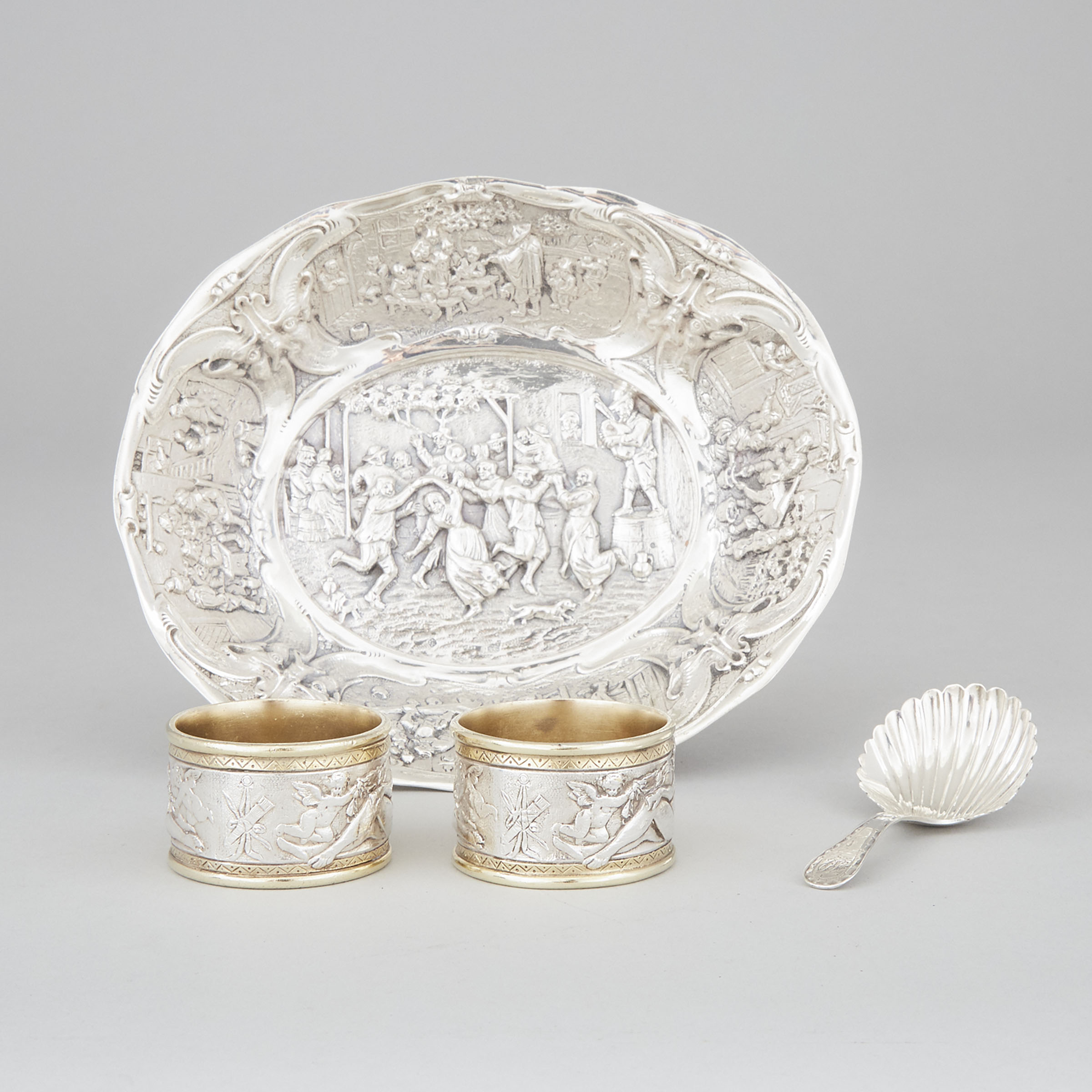 George III Silver Caddy Spoon, John Emes, London, c.1800, Later Dutch Silver Oval Dish and a Cased Pair of Silver Plated Napkin Rings, Elkington & Co. late 19th century