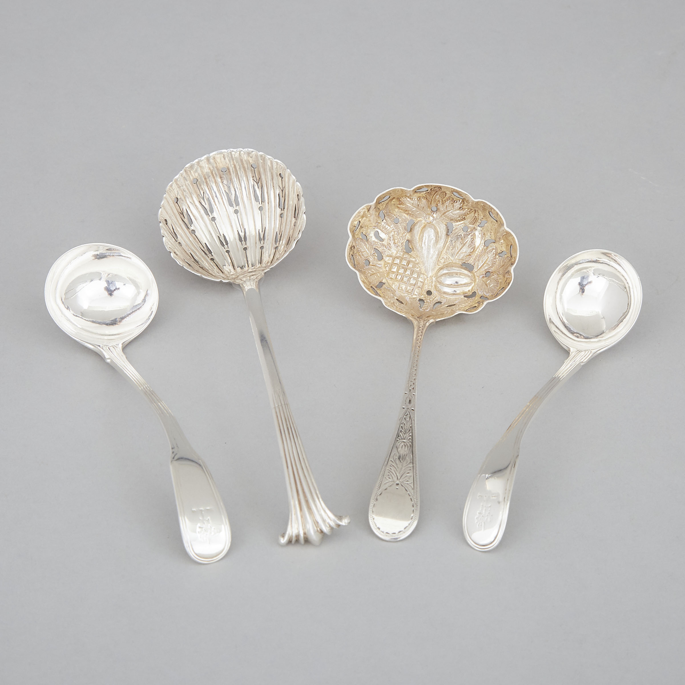 Two George III Silver Sugar Sifting Ladles and Two Sauce Ladles, London, c.1775-1800