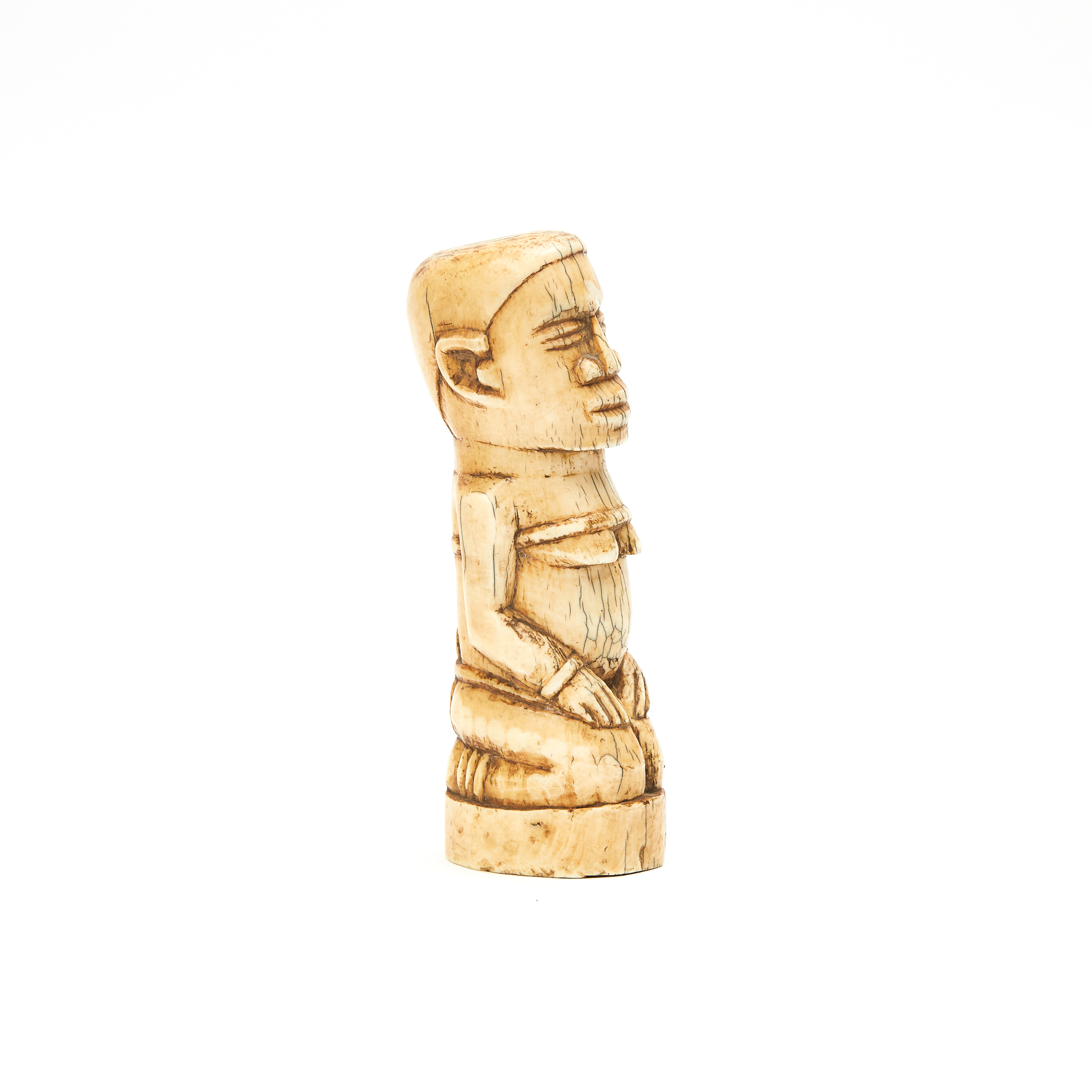 Kongo Carved Ivory Kneeling Figure, early to mid 20th century, Democratic Republic of Congo, Central Africa
