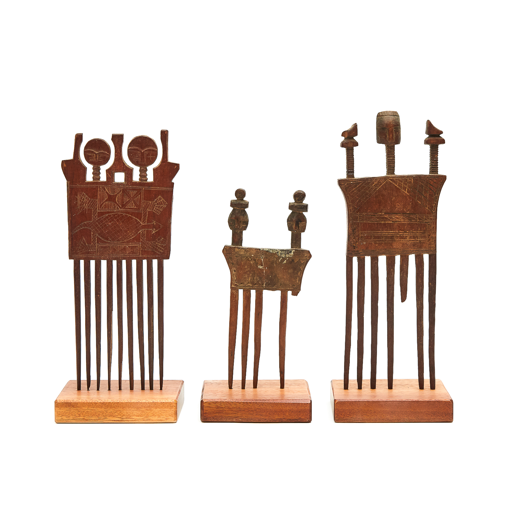 A Group of Three Akan Figural Combs, West Africa