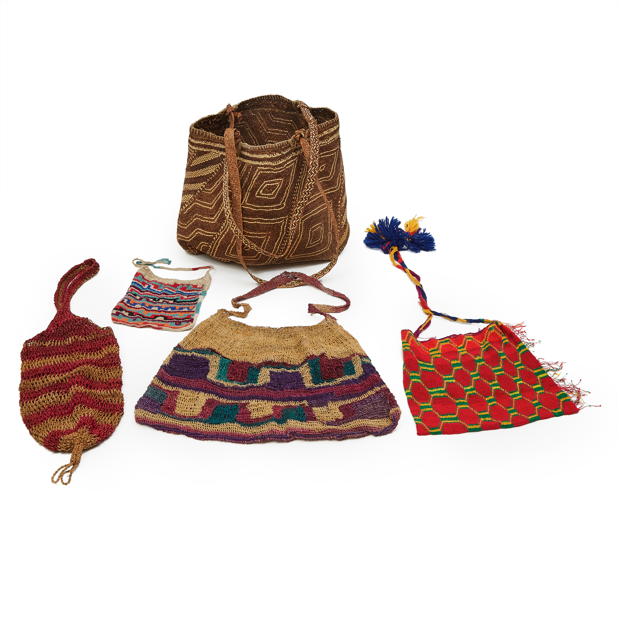 Four Woven Bilum Bags together with a woven raffia bag, Papua New Guinea