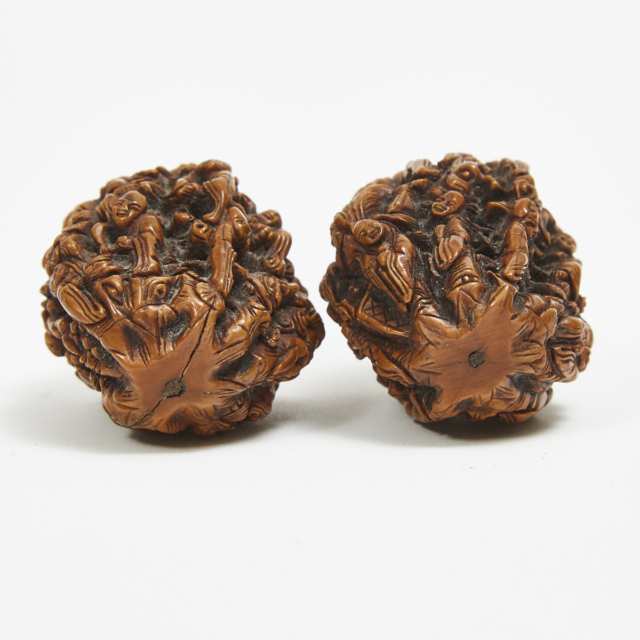 A Pair of 'Eighteen Luohans' Carved Walnuts, Qing Dynasty