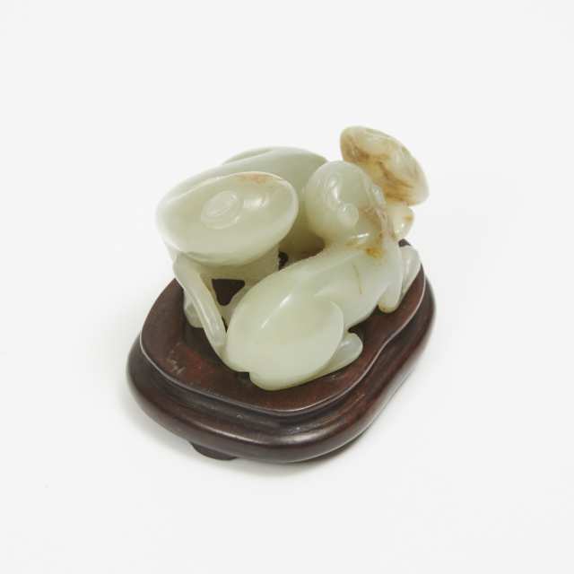 A Celadon Jade and Russet 'Double Cats' Carving