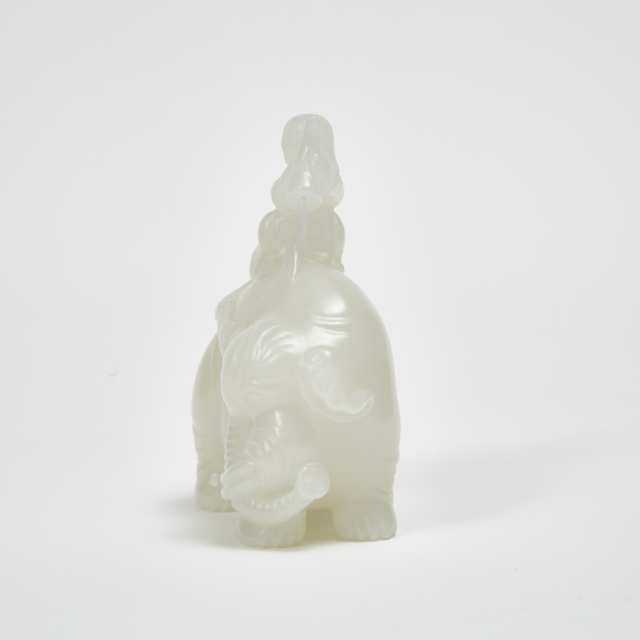 A White Jade Carved 'Cleaning the Elephant' Group