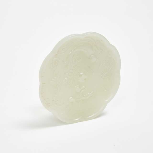 A Small Tang-Style White Jade Mirror-Form Carving