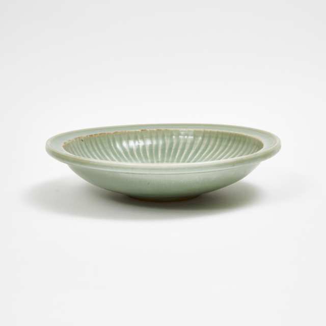 A Longquan Celadon Carved Charger, Ming Dynasty 